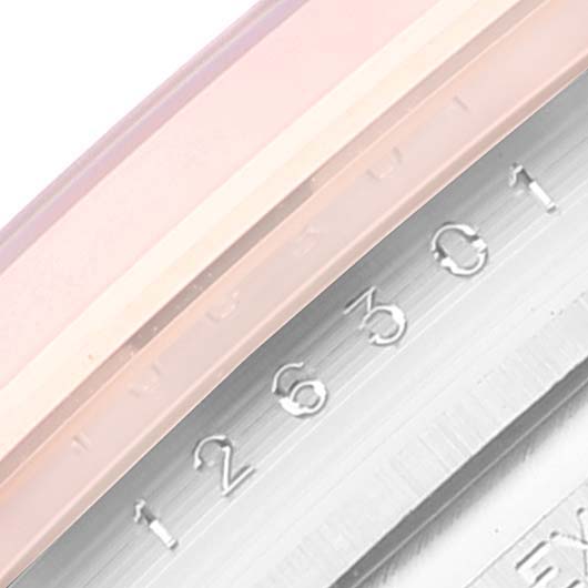 The image shows a close-up view of the serial number engraved on the side of the Rolex Datejust 41 126301 Men's Steel and Gold (two tone) Grey Dial 126301 Men's Steel and Gold (two tone) Grey Dial watch case.