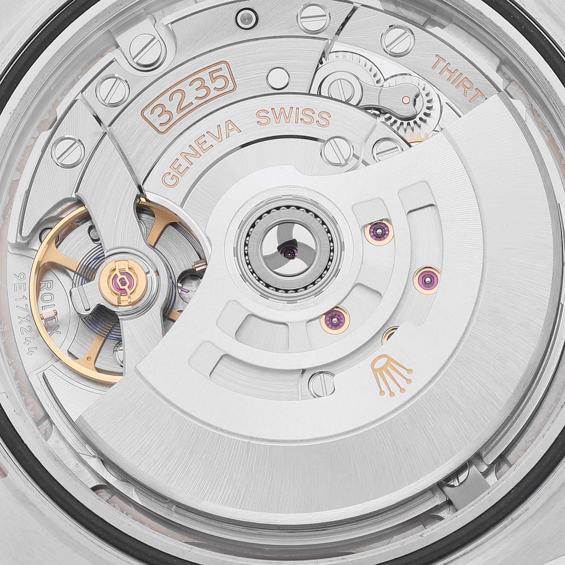 This is a close-up view of the movement in a Rolex Datejust 41 126301 Men's Steel and Gold (two tone) Grey Dial 126301 Men's Steel and Gold (two tone) Grey Dial watch, showing intricate mechanical parts.