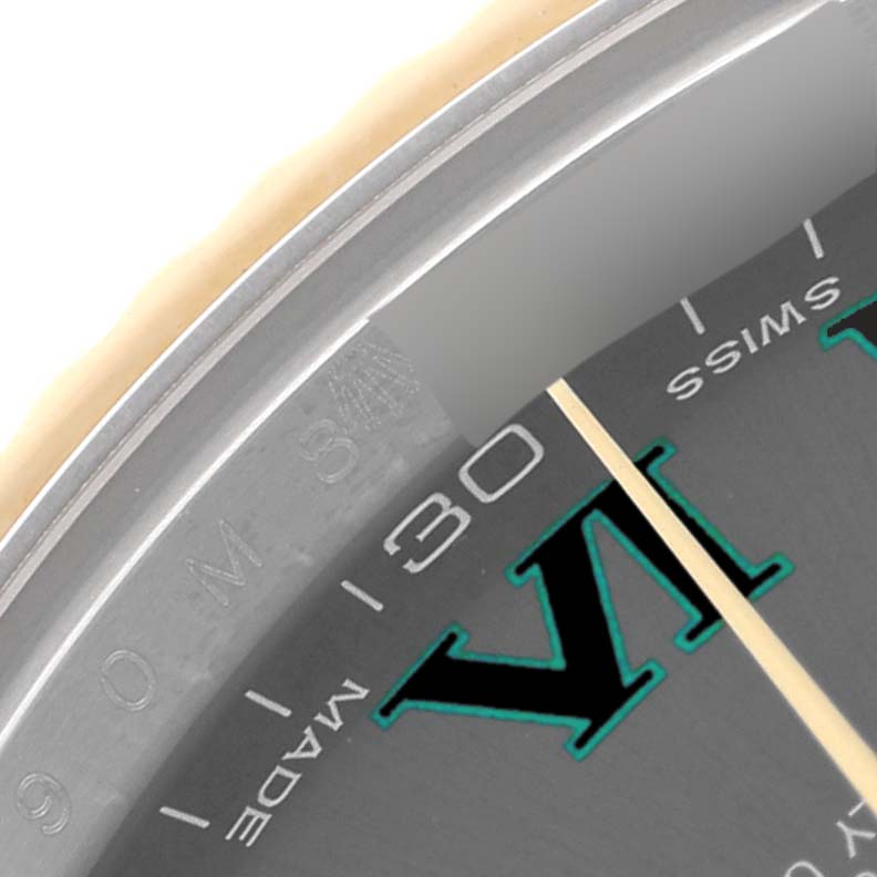 This image shows a close-up of the dial and part of the bezel of a Rolex Datejust 41 116333 Men's Steel and Gold (two tone) Grey Dial 116333 Men's Steel and Gold (two tone) Grey Dial, focusing on the "VI" marker.