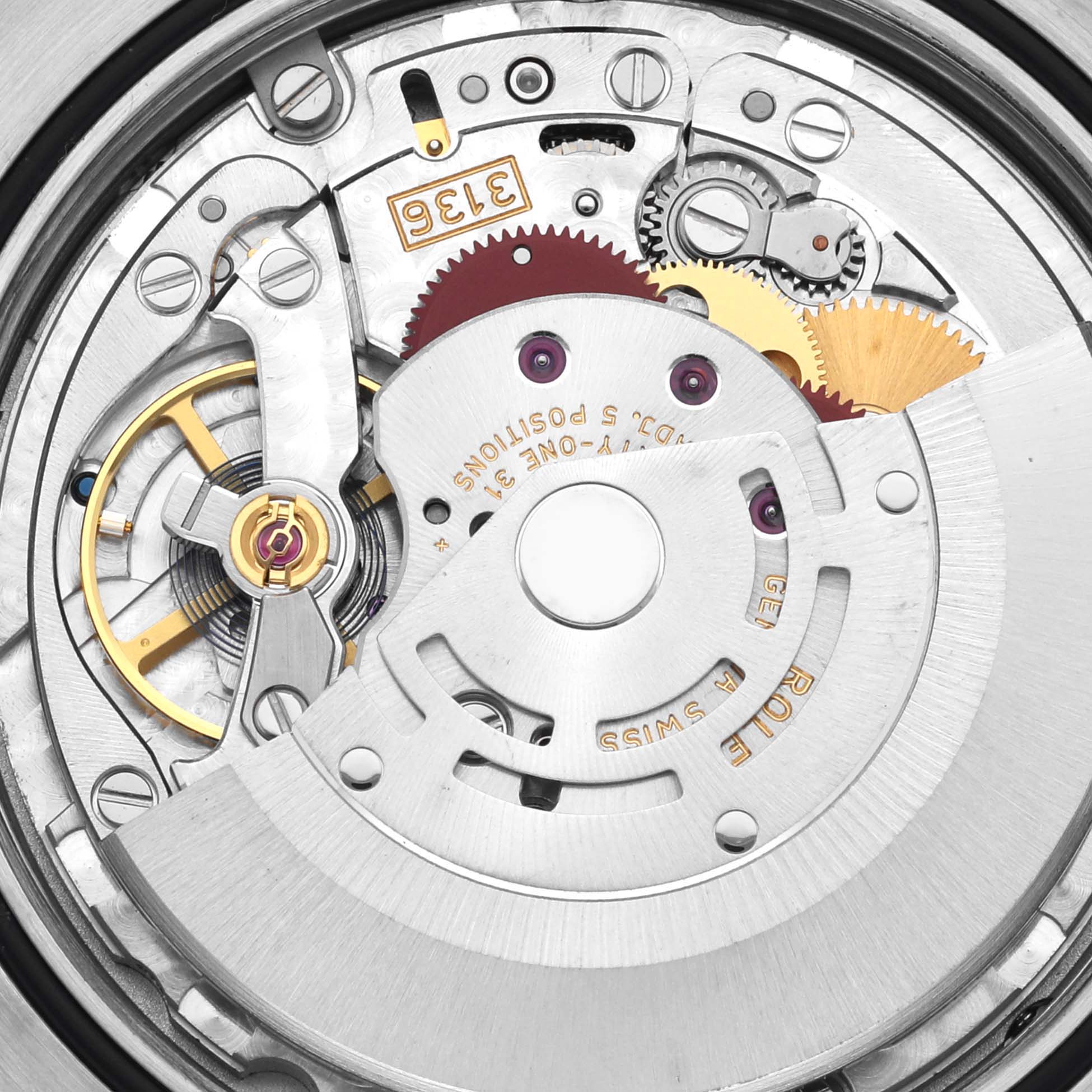 This image shows a close-up view of the automatic movement inside a Rolex Datejust 41 116333 Men's Steel and Gold (two tone) Grey Dial 116333 Men's Steel and Gold (two tone) Grey Dial watch, highlighting the gears and components.