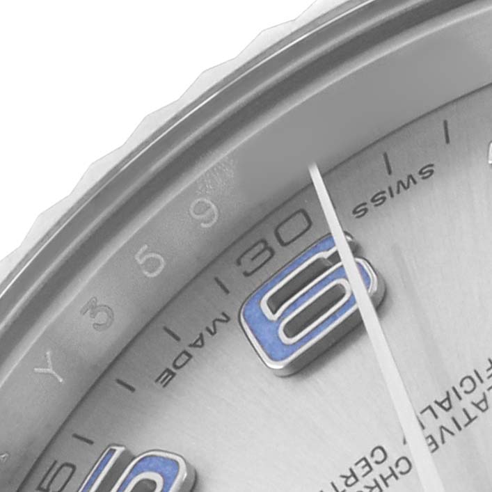 The image shows a close-up of a Rolex Datejust 41 116334 Men's Stainless Steel Silver Dial watch dial from an angle emphasizing the numerals, markers, and hands.