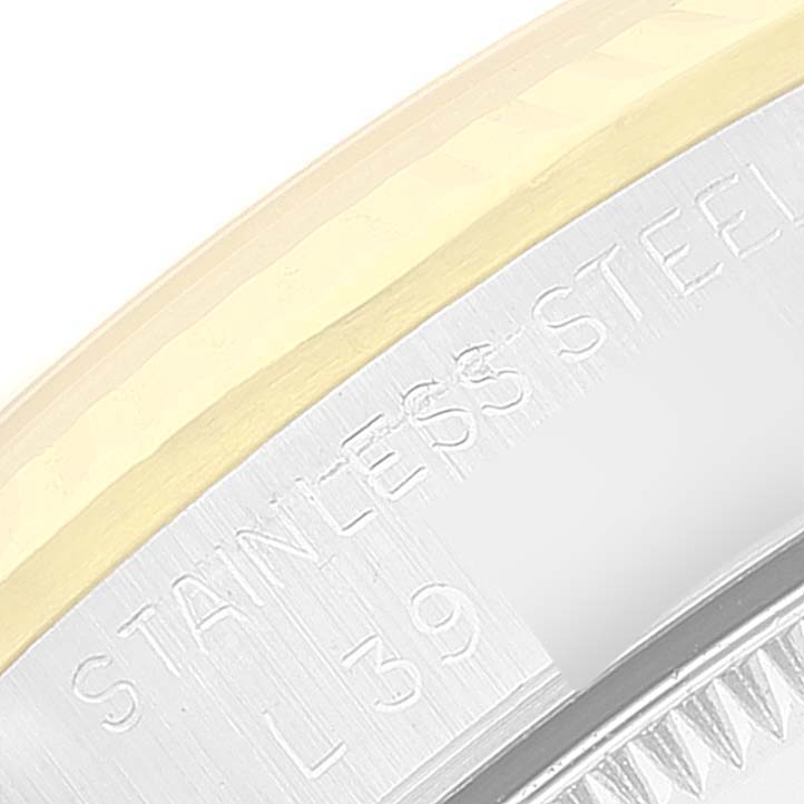 The image shows a close-up of the bezel and part of the stainless steel case of the Rolex Mid-Size 68273 Women
s Steel and Gold (two tone) Champagne Dial 68273 Women
s Steel and Gold (two tone) Champagne Dial watch.