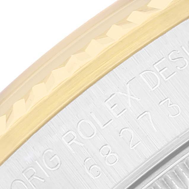 The image shows a close-up of the outer edge and engraving on the case back of a Rolex Mid-Size 68273 Women
s Steel and Gold (two tone) Champagne Dial 68273 Women
s Steel and Gold (two tone) Champagne Dial model watch.