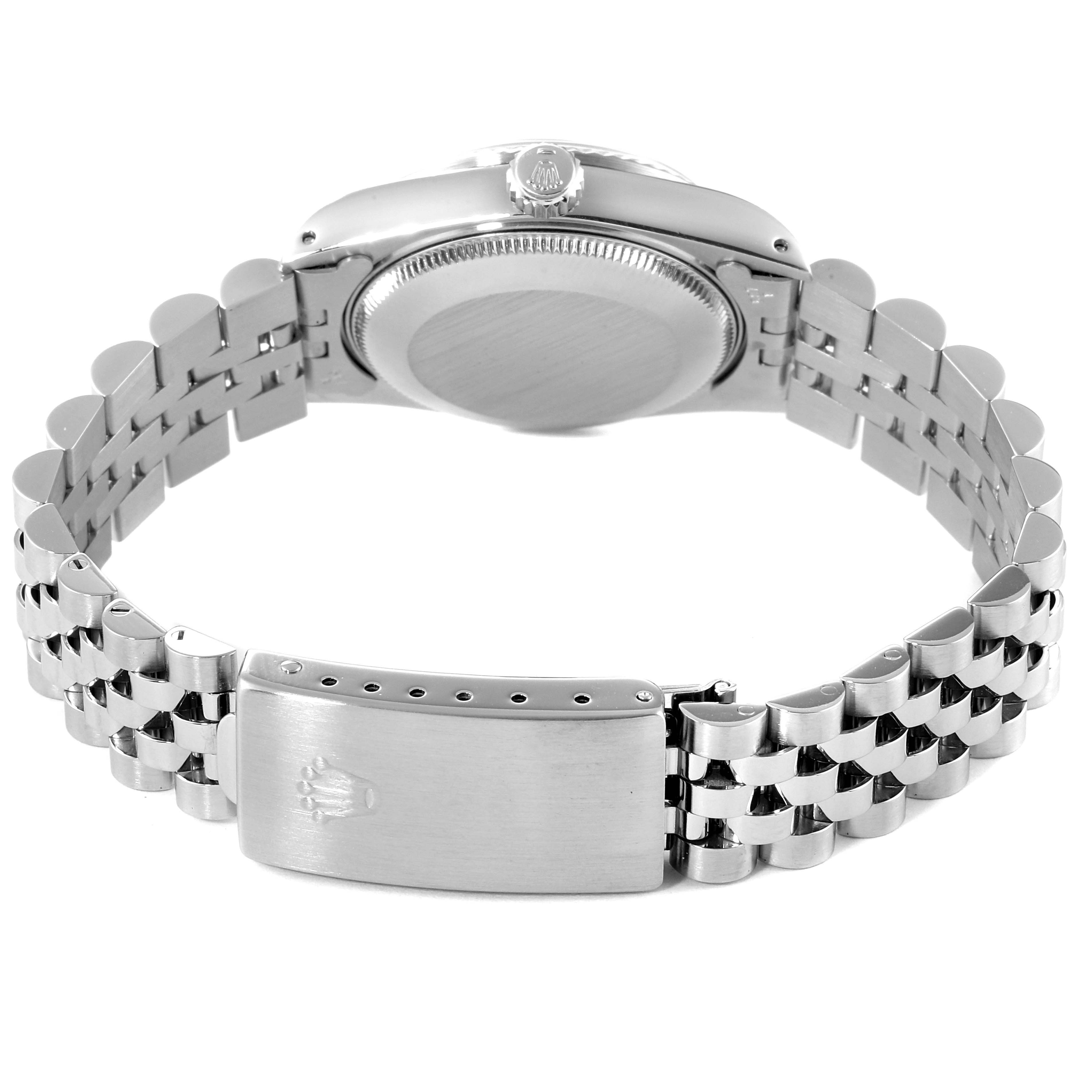 The image shows the back of a Mid-Size Rolex watch, highlighting the bracelet, clasp, and case back.