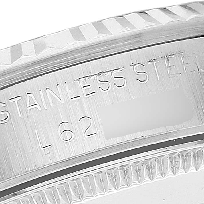 This image shows a close-up of the side engraving on the bezel and case of a mid-size Rolex watch.