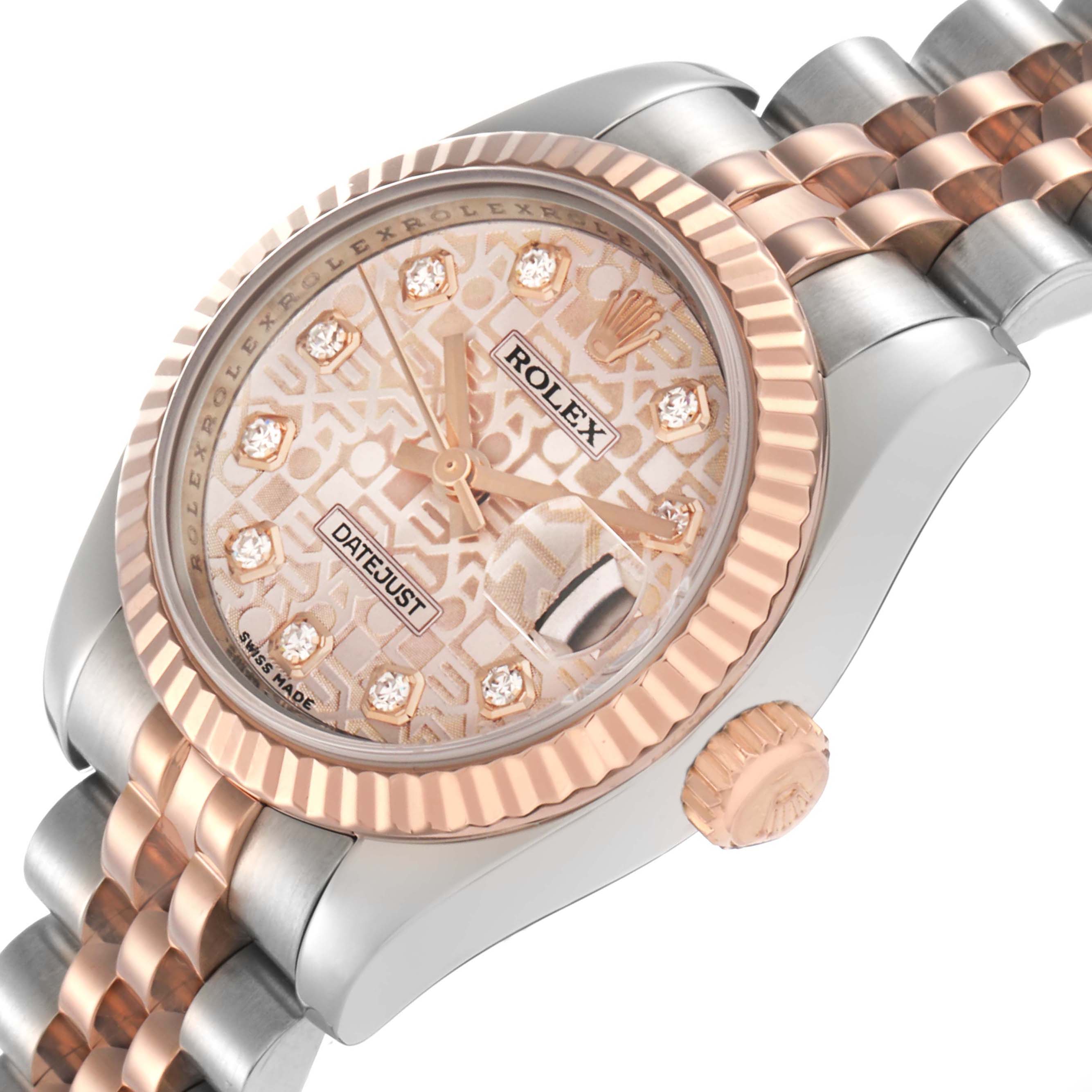 The Rolex Datejust 179171 Women
s Steel and Gold (two tone) Pink Dial watch is shown at an angled view, displaying its face, bezel, partially visible bracelet, and crown.