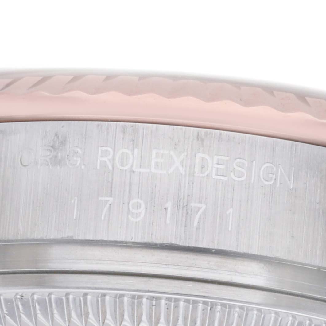The image shows a close-up of the bezel and case side of a Rolex Datejust 179171 Women
s Steel and Gold (two tone) Pink Dial, highlighting the engraved model details.