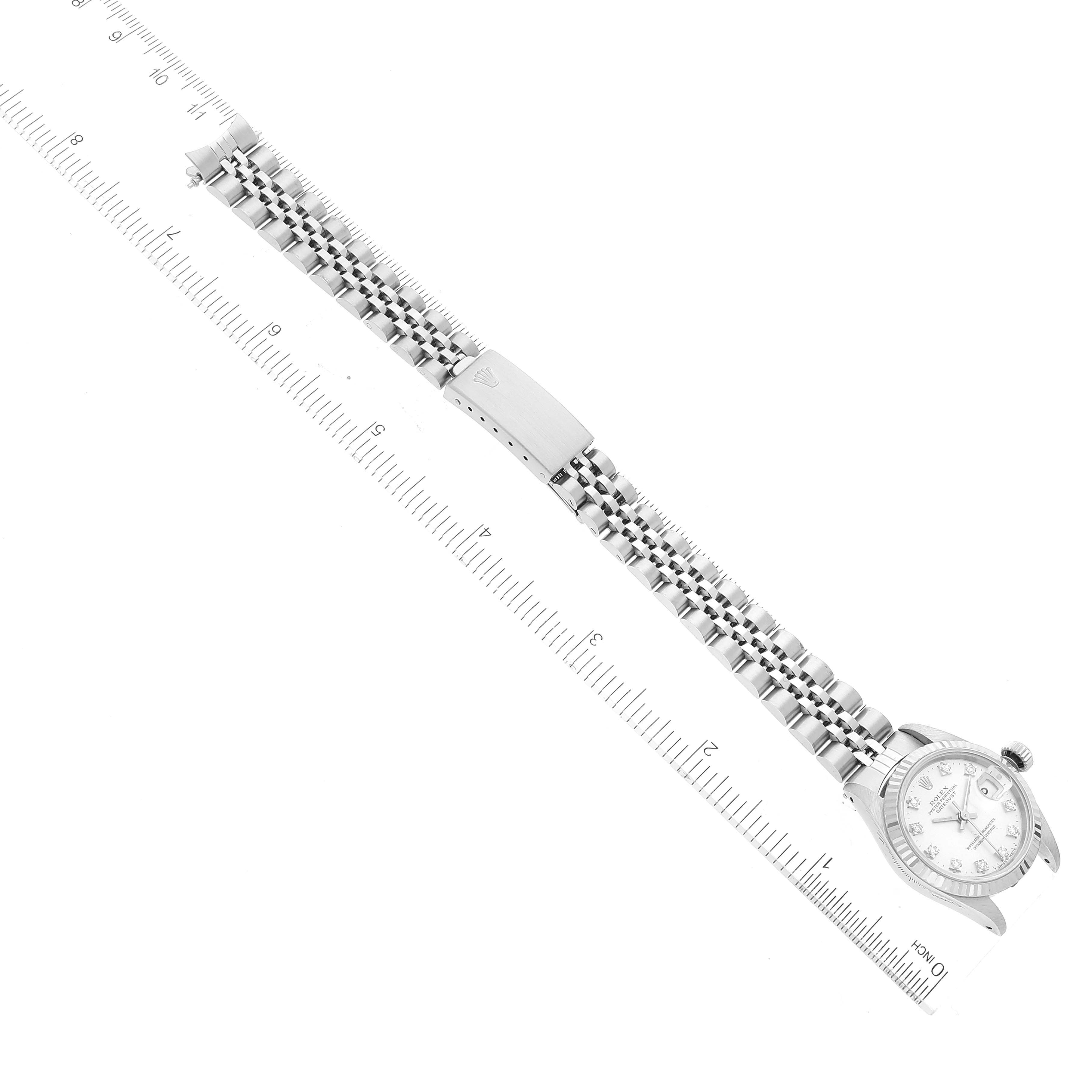 The image shows a Rolex Datejust 69174 Women's Stainless Steel Silver Dial 69174 Women's Stainless Steel Silver Dial watch laid flat, displaying the full length of the bracelet and face, alongside a measurement ruler.