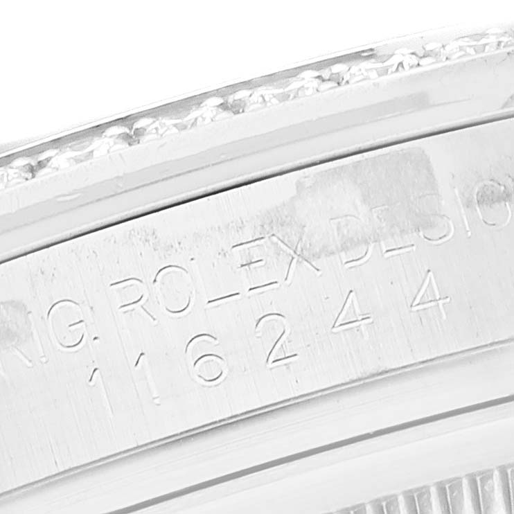 The image shows a close-up of the engraving on the case back of a Rolex Datejust 116244 Men's Stainless Steel White Dial 116244 Men's Stainless Steel White Dial watch.