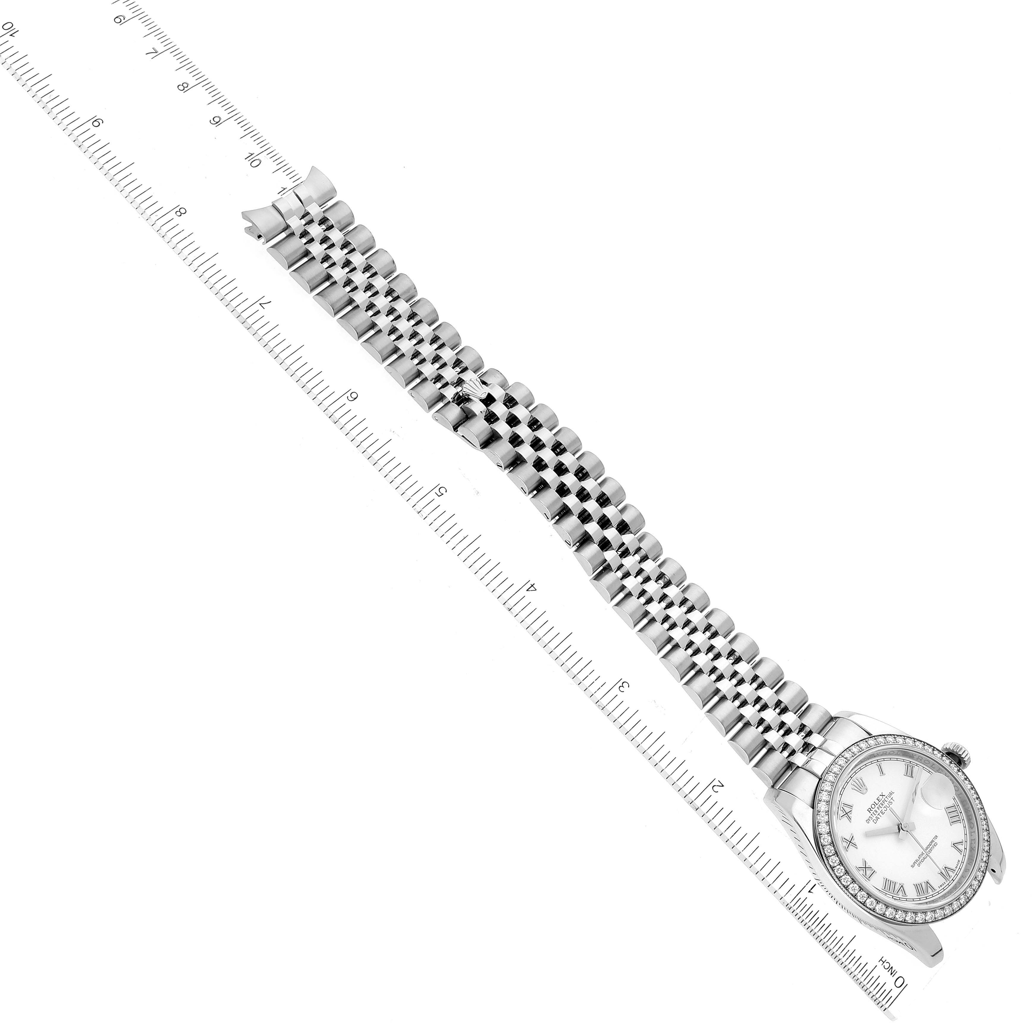 The image shows the Rolex Datejust 116244 Men's Stainless Steel White Dial 116244 Men's Stainless Steel White Dial watch from a top-down angle, highlighting the face, bezel, and full metal bracelet alongside a ruler.