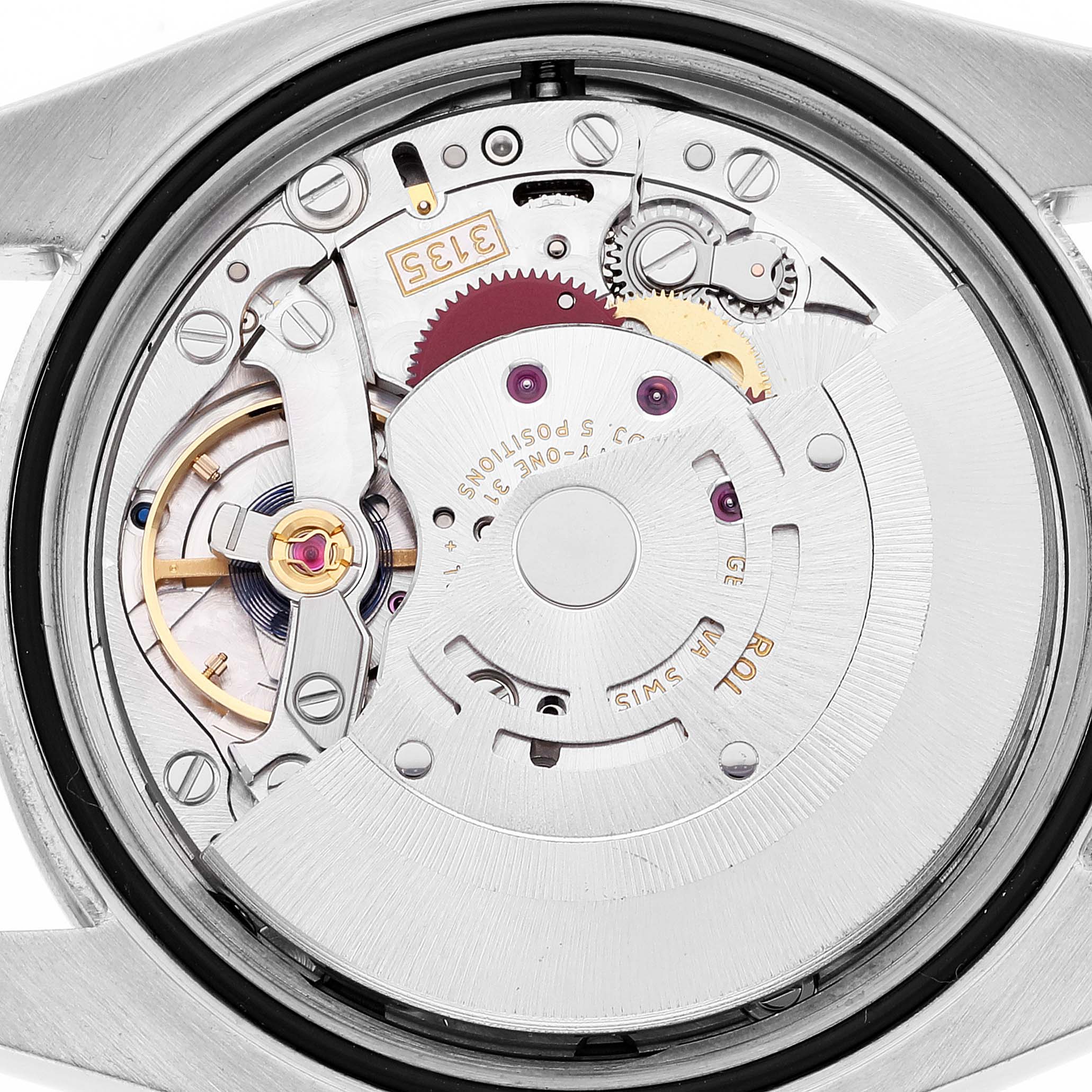 The image shows the internal movement components of a Rolex Datejust 116244 Men's Stainless Steel White Dial 116244 Men's Stainless Steel White Dial watch from a close-up, back angle view.