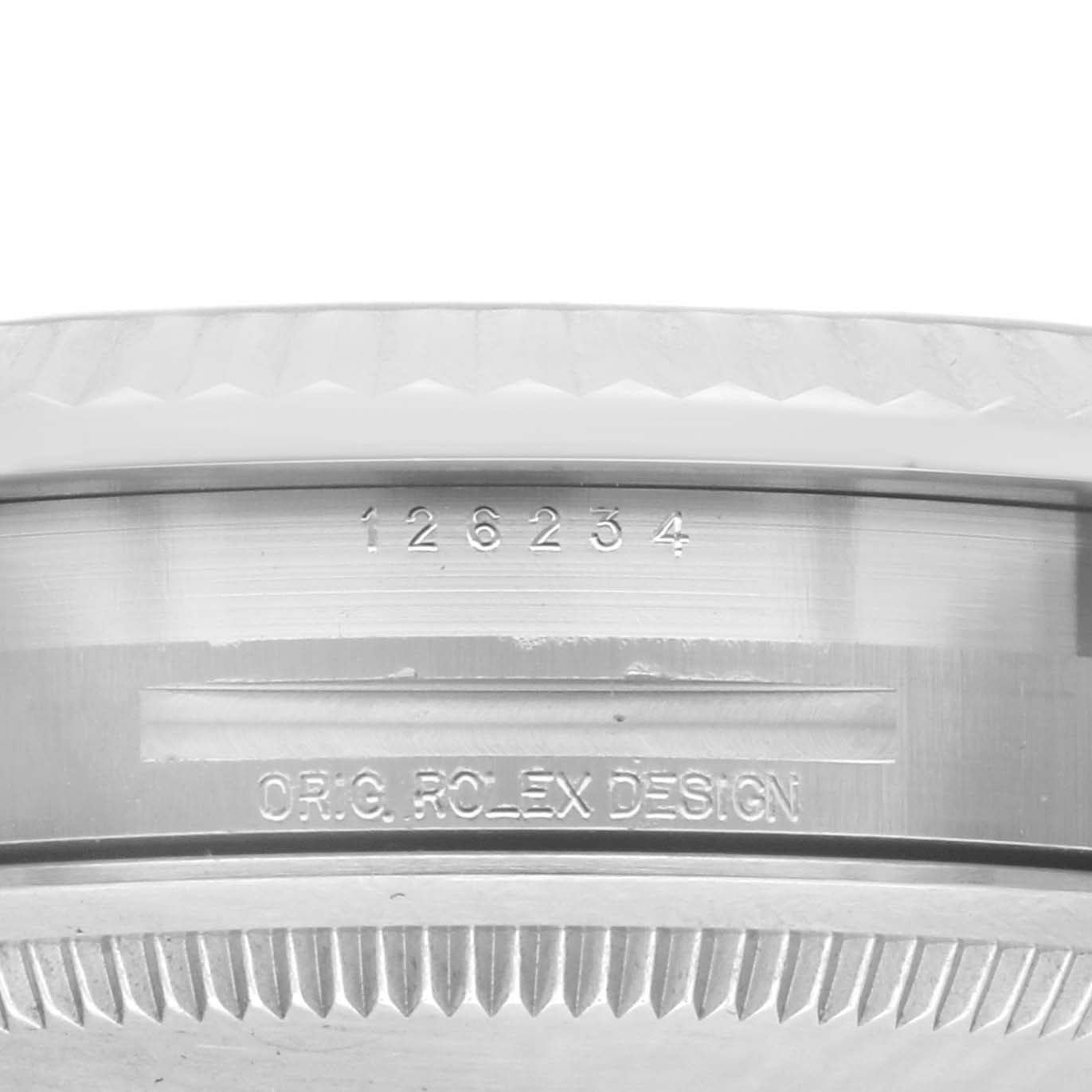 The image shows the side view of a Rolex Datejust 126234 Men's Stainless Steel Silver Dial model, focusing on the serial and design markings on the case.