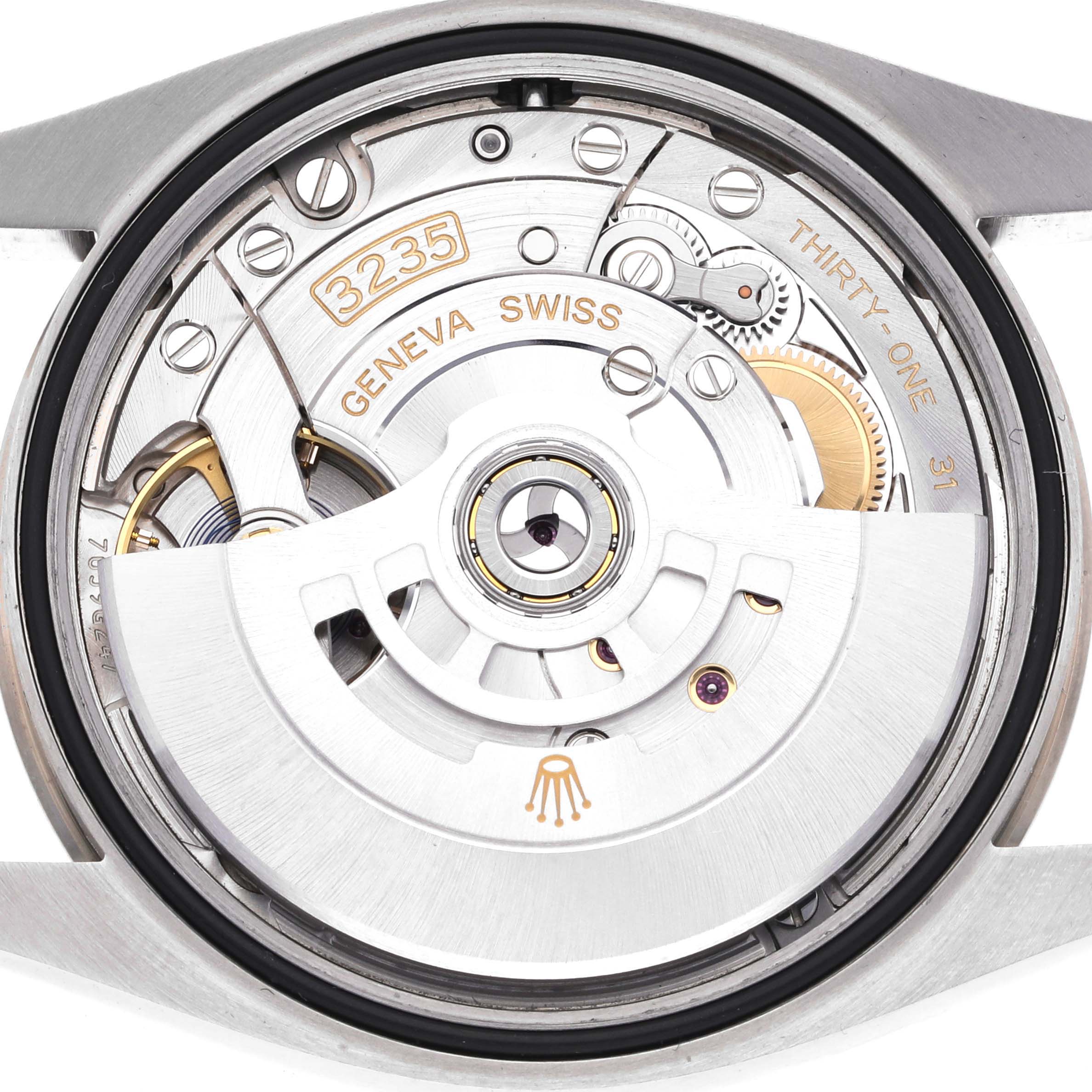 The image shows the movement and rotor of a Rolex Datejust 126234 Men's Stainless Steel Silver Dial watch from the back.
