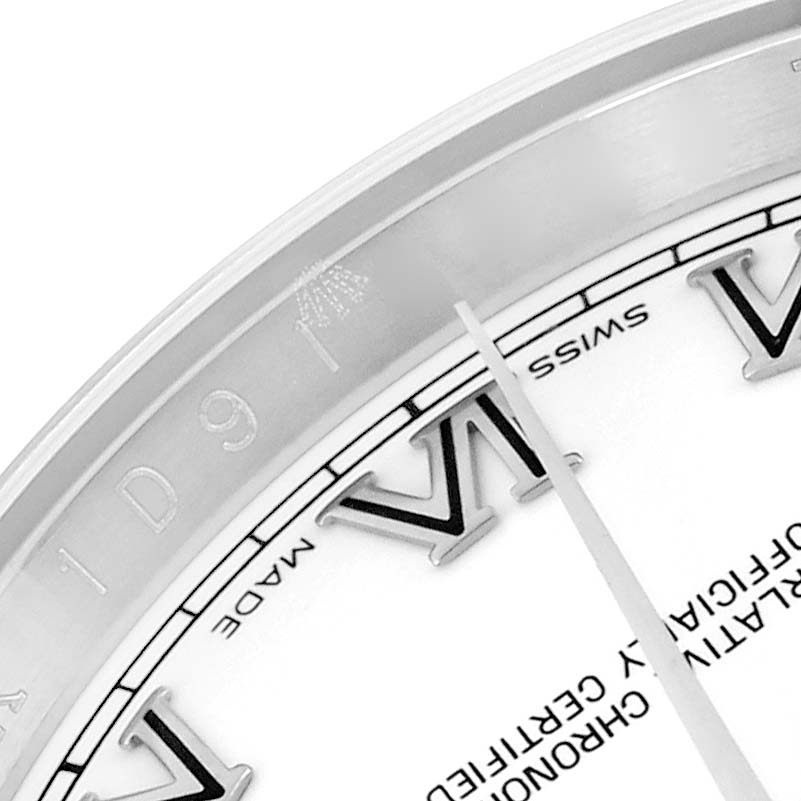 The image shows a close-up of the dial section of a Rolex Datejust 116234 Men
s Stainless Steel White Dial, featuring Roman numerals and part of the bezel.