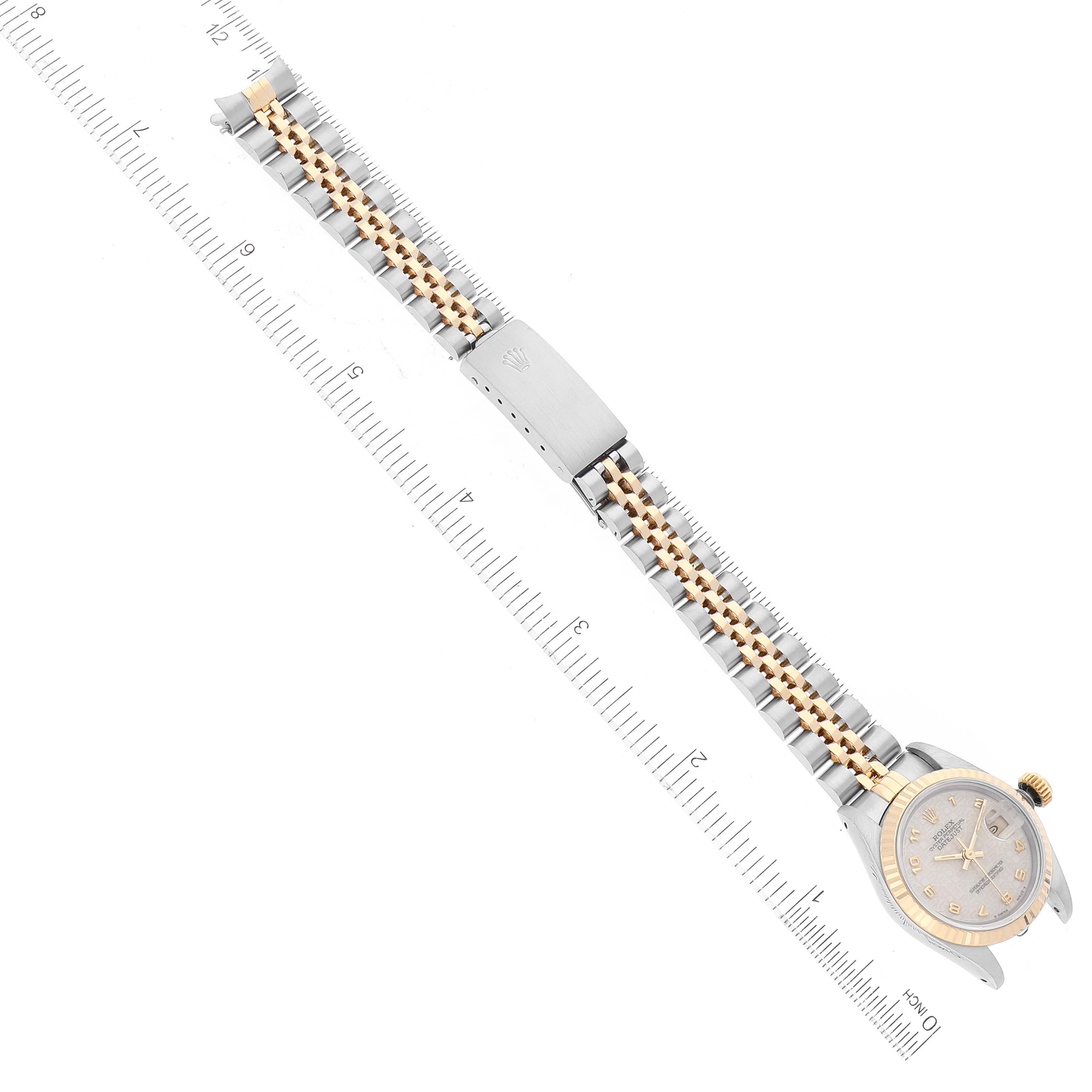The image shows a Rolex Datejust 69173 Women's Steel and Gold (two tone) Beige Dial 69173 Women's Steel and Gold (two tone) Beige Dial watch laid flat with both the face and the metal and gold bracelet visibly extended alongside a ruler.
