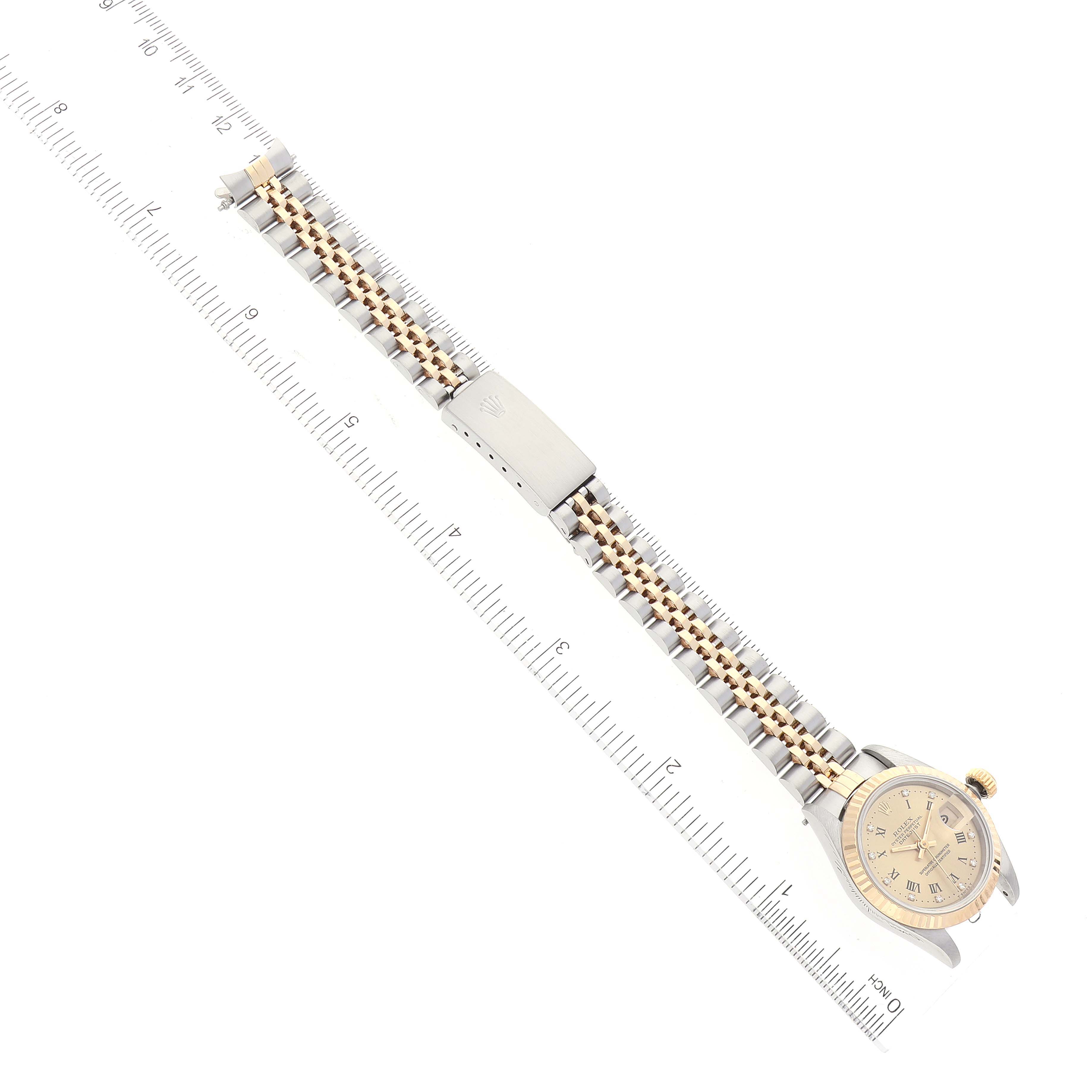 The Rolex Datejust 69173 Women's Steel and Gold (two tone) Champagne Dial 69173 Women's Steel and Gold (two tone) Champagne Dial watch is shown from a top-down angle, highlighting the bracelet and clasp with the dial partially visible.