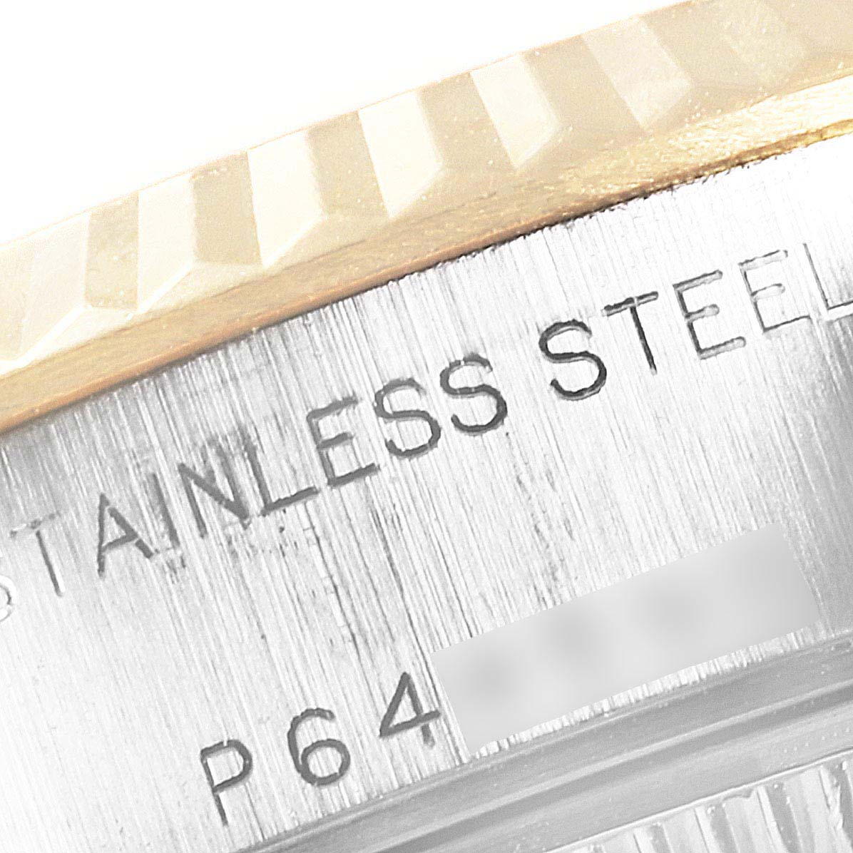 This close-up image shows the fluted bezel and part of the stainless steel casing of a Rolex Datejust 79173 Women's Steel and Gold (two tone) Champagne Dial 79173 Women's Steel and Gold (two tone) Champagne Dial watch.