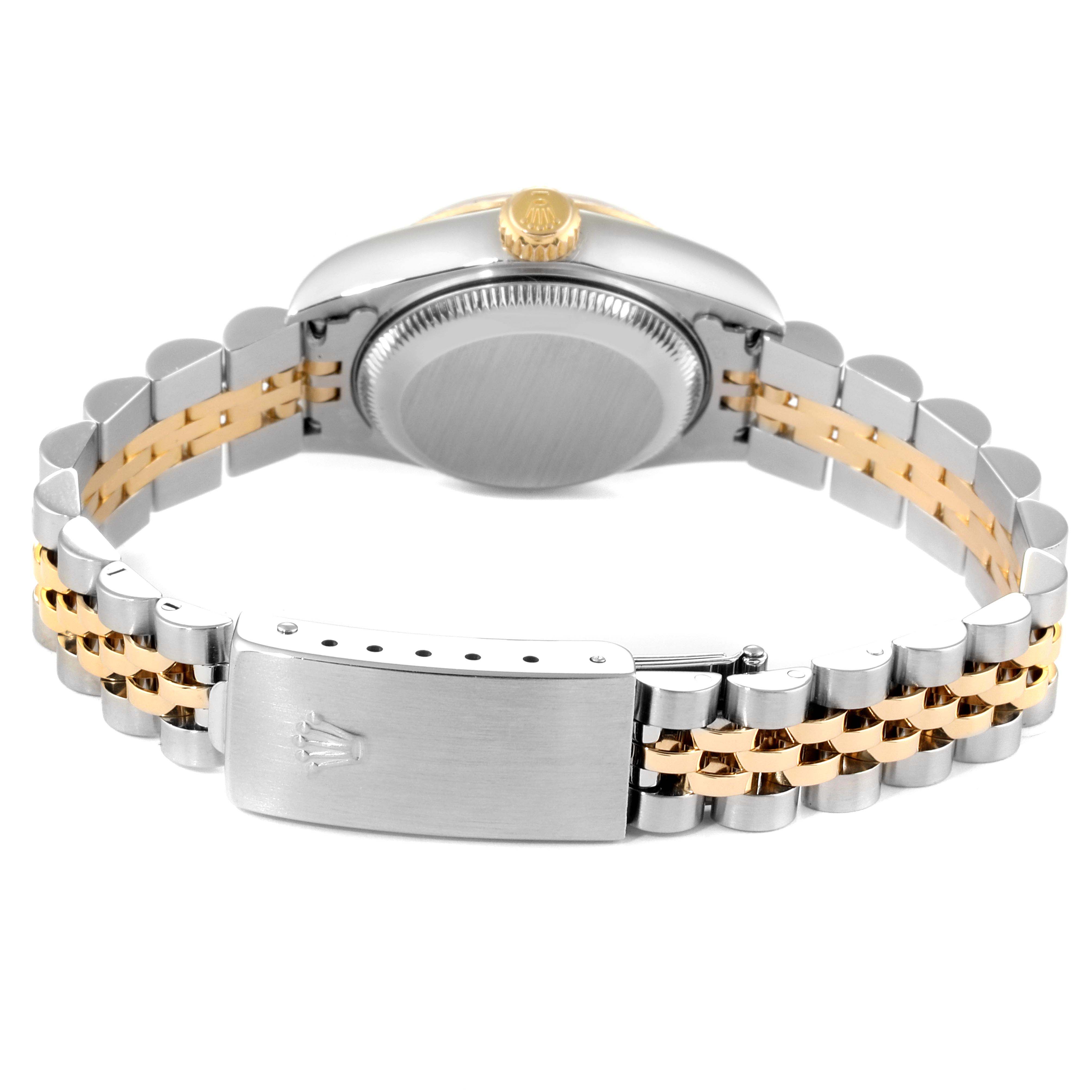 The image shows a rear view of a Rolex Datejust 79173 Women's Steel and Gold (two tone) Champagne Dial 79173 Women's Steel and Gold (two tone) Champagne Dial watch, focusing on the case back and the two-tone bracelet with clasp.