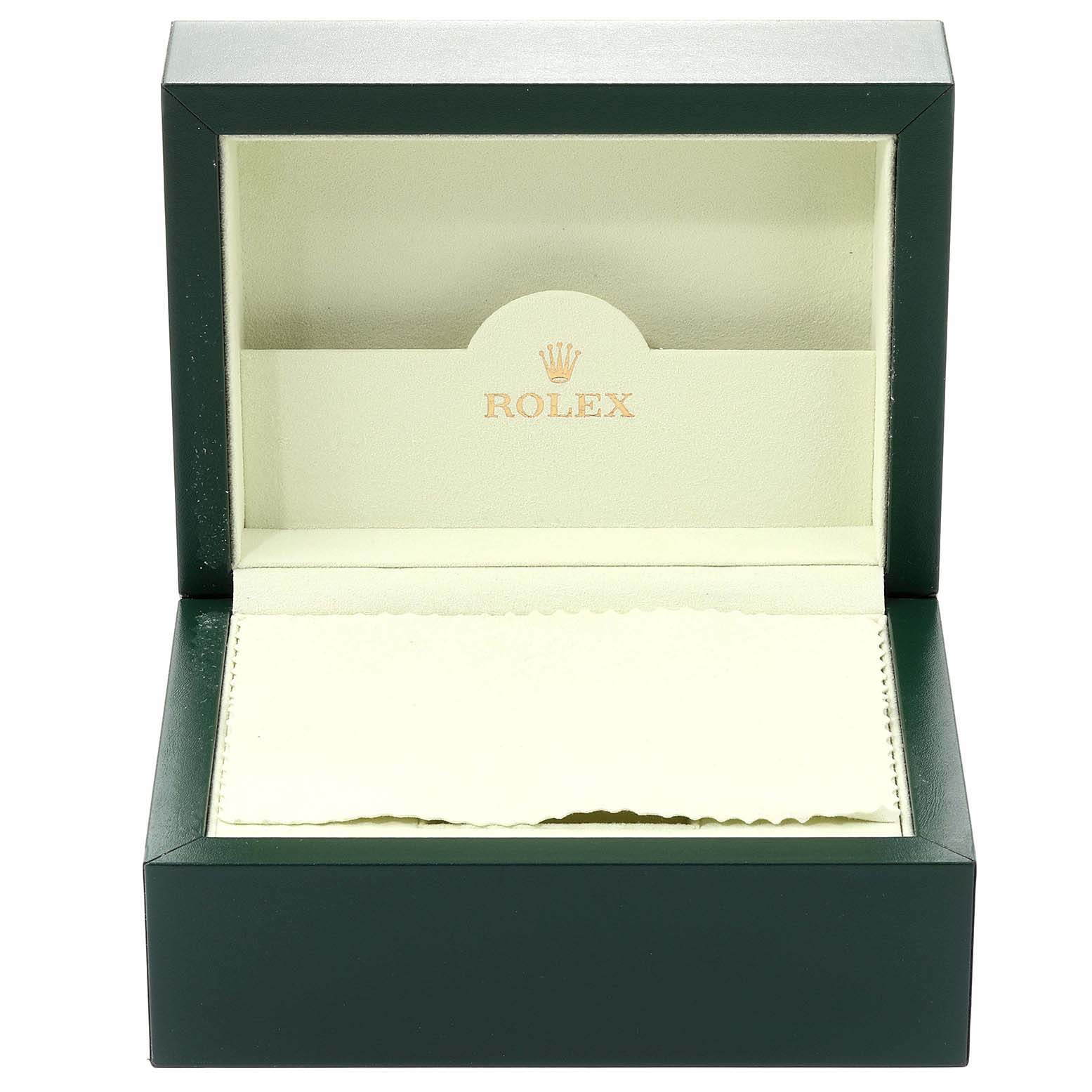 The image shows an open green Rolex box, likely for a Datejust model, displaying its interior without the watch.