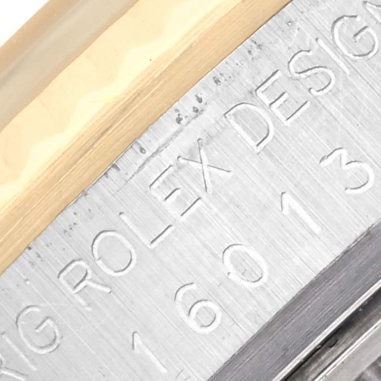 This close-up image shows the bezel and engraved serial number of the Vintage Collection model by Rolex.