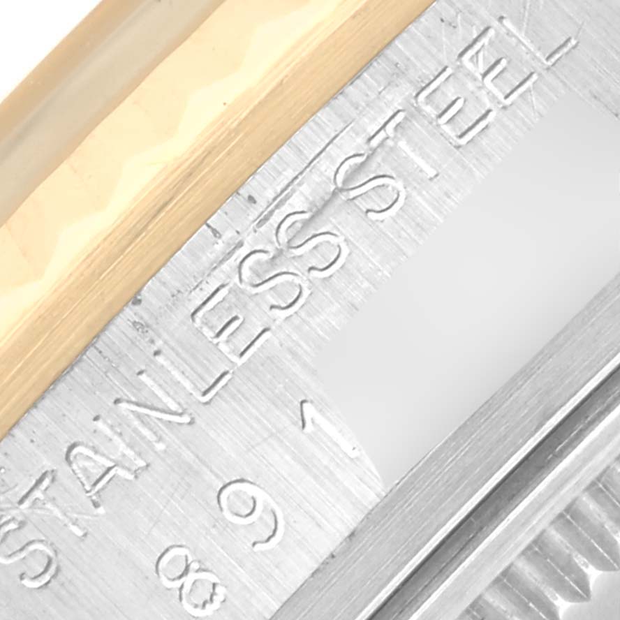 This close-up image shows the stainless steel and gold bezel of a Rolex Vintage Collection 16013 Men's Steel and Gold (two tone) Silver Dial 16013 Men's Steel and Gold (two tone) Silver Dial watch, highlighting the engraved text.