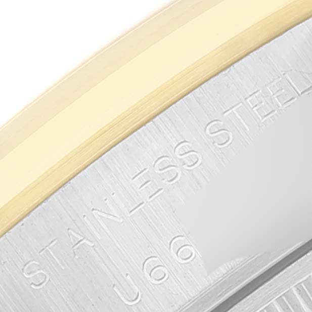 This close-up image shows the side engraving and part of the bezel of the Rolex Datejust 69163 Women
s Steel and Gold (two tone) Grey Dial 69163 Women
s Steel and Gold (two tone) Grey Dial watch.