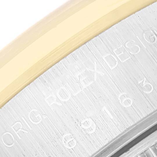 This close-up image shows the side engraving on the bezel of a Rolex Datejust 69163 Women
s Steel and Gold (two tone) Grey Dial 69163 Women
s Steel and Gold (two tone) Grey Dial watch.