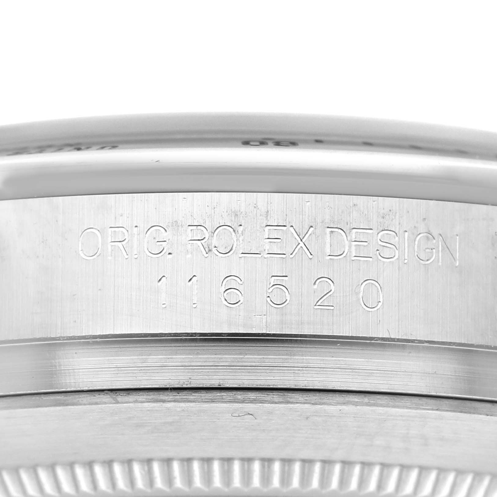 This close-up angle showcases the engraved serial and design number on the side of the Rolex Daytona 116520 Men's Stainless Steel Black Dial 116520 Men's Stainless Steel Black Dial watch case.