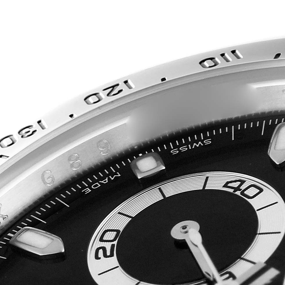 The image shows a close-up of the dial and bezel of a Rolex Daytona 116520 Men's Stainless Steel Black Dial 116520 Men's Stainless Steel Black Dial watch, focusing on the 120-130 on the bezel and part of the sub-dial.