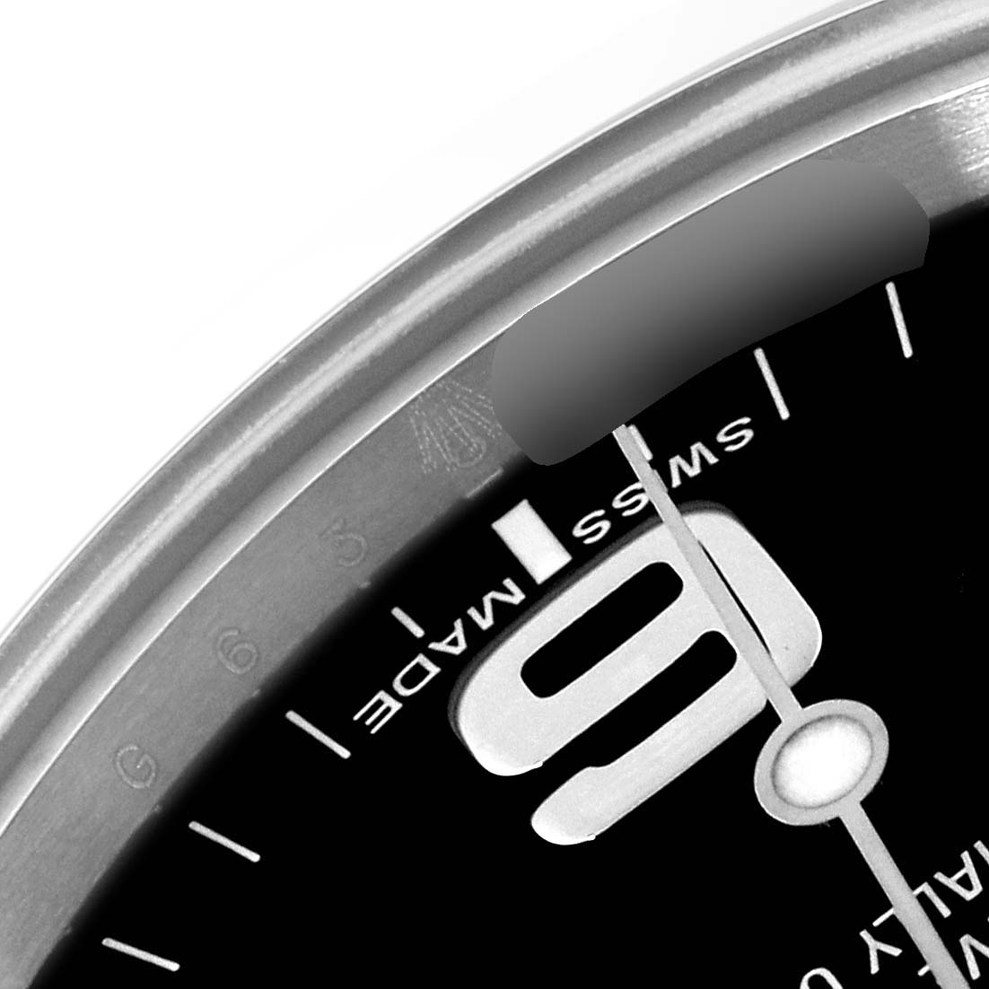 The image shows a close-up angle of the dial and part of the bezel of a Rolex Explorer 214270 Men's Stainless Steel Black Dial 214270 Men's Stainless Steel Black Dial model watch, highlighting the "SWISS MADE" text and the number 9.