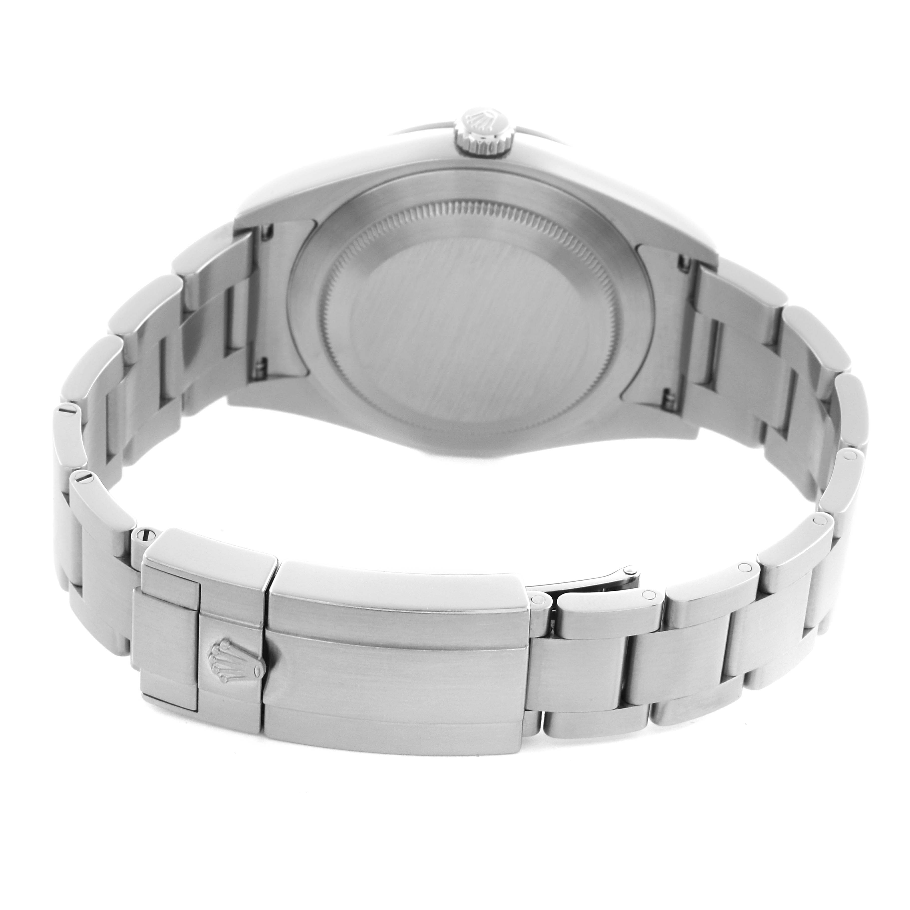 The image shows the back of a Rolex Explorer 214270 Men's Stainless Steel Black Dial watch, highlighting the clasp, bracelet, and caseback from a rear angle.
