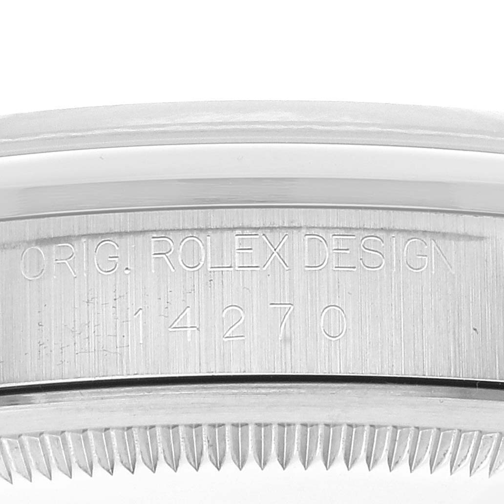 A close-up shot of the Rolex Explorer 14270 Men
s Stainless Steel Black Dial 14270 Men
s Stainless Steel Black Dial model showing the engraved case with serial number 14270.