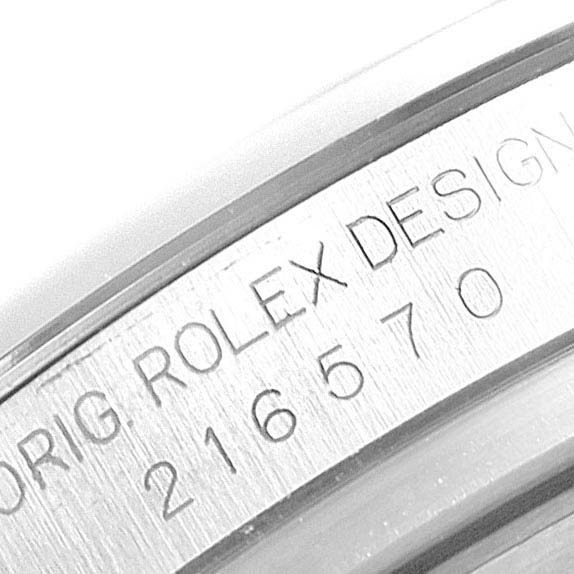 This is a macro shot of the side engraving on a Rolex Explorer 216570 Men
s Stainless Steel Black Dial 216570 Men
s Stainless Steel Black Dial watch, showing its original design number 216570.