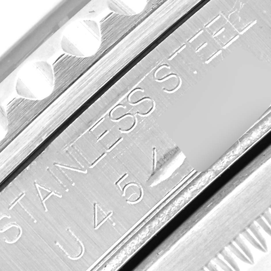 Close-up of the case side of a Rolex GMT-Master 16700 Men's Stainless Steel Black Dial 16700 Men's Stainless Steel Black Dial, showing the engraved "STAINLESS STEEL" and partial bezel edge.