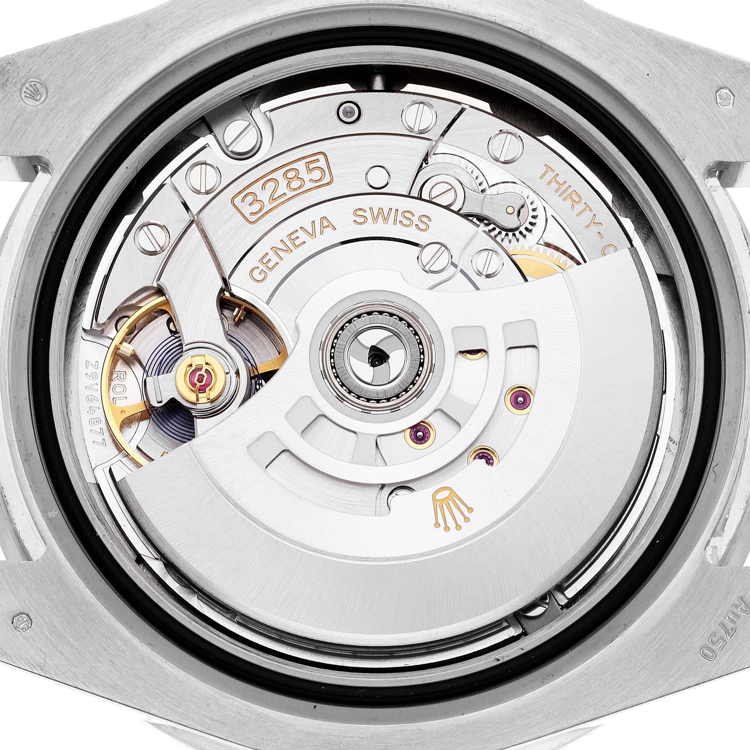 The image shows the movement mechanism of a Rolex GMT-Master 126719 Men's White Gold Blue Dial 126719 Men's White Gold Blue Dial watch, viewed from the back, highlighting the rotor, gears, and inscriptions.