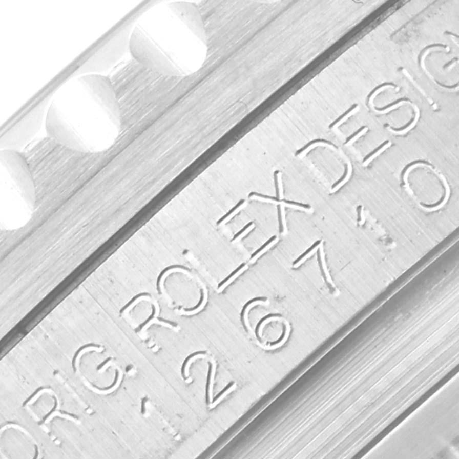The image shows a close-up of the inner bezel engraving on a Rolex GMT-Master 126710 Men's Stainless Steel Black Dial 126710 Men's Stainless Steel Black Dial watch, highlighting the "ROLEX DESIGN" text.