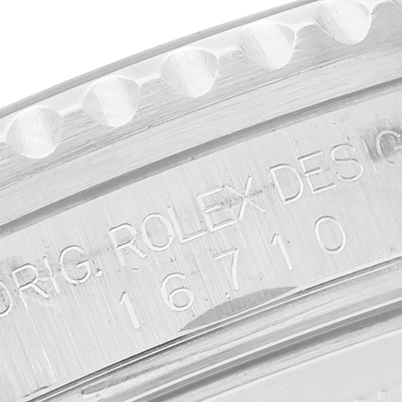 This close-up image shows the etched case side of a Rolex GMT-Master 16710 Men's Stainless Steel Black Dial 16710 Men's Stainless Steel Black Dial model, highlighting the model number 16710.
