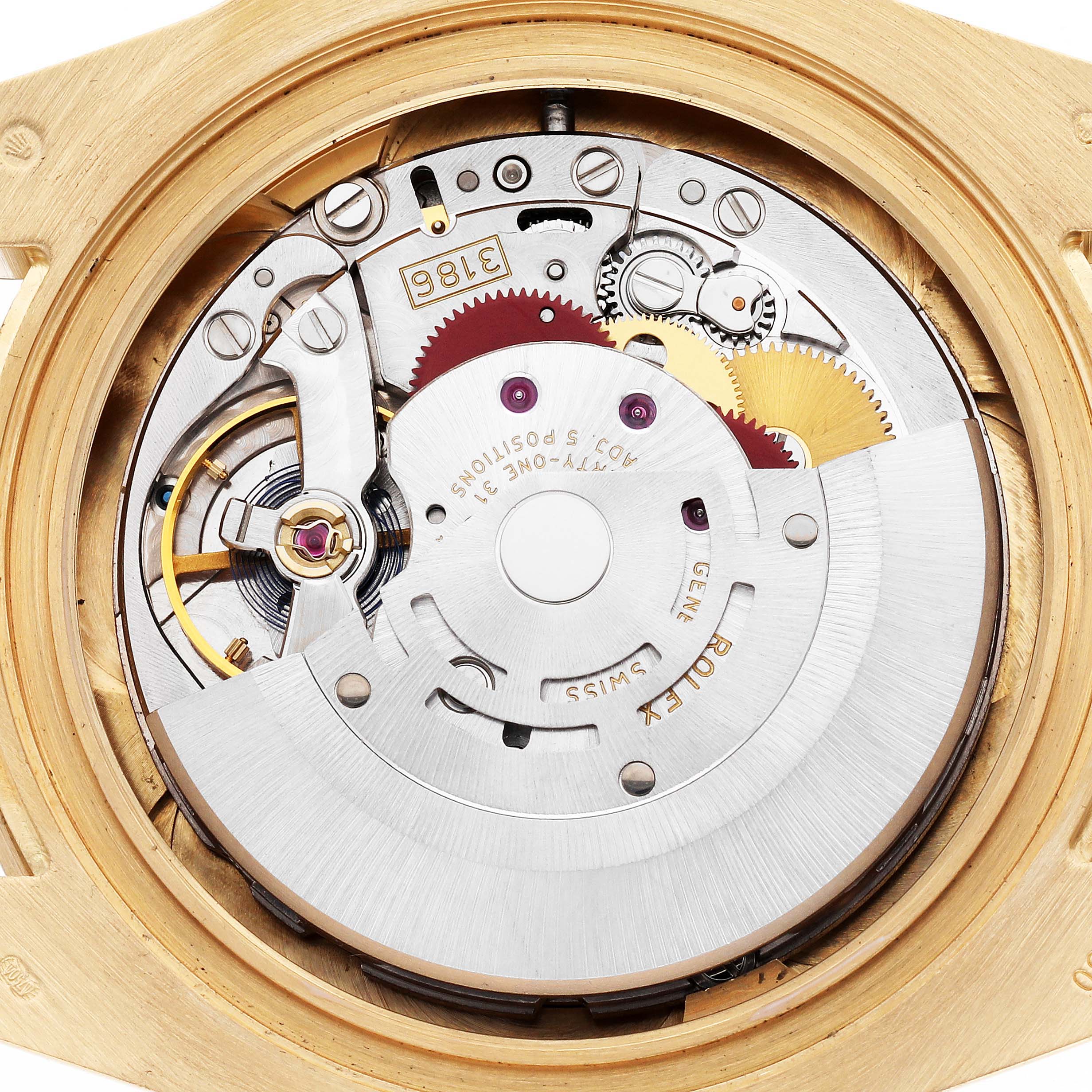 The image shows the movement of a Rolex GMT-Master 116718 Men
s Yellow Gold Green Dial watch from a rear angle, highlighting its intricate mechanical components.