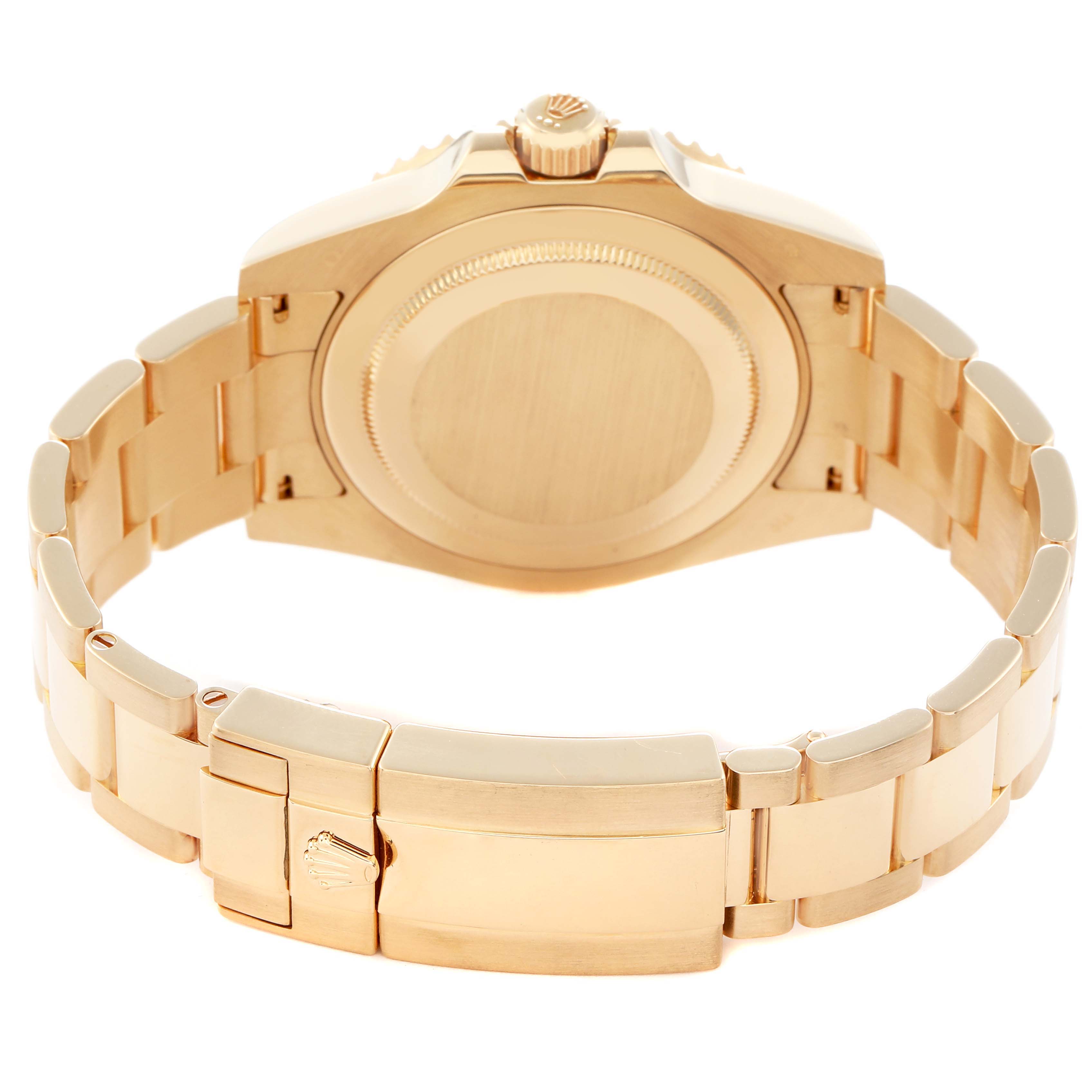 The image shows the back and bracelet clasp of a Rolex GMT-Master 116718 Men
s Yellow Gold Green Dial watch.