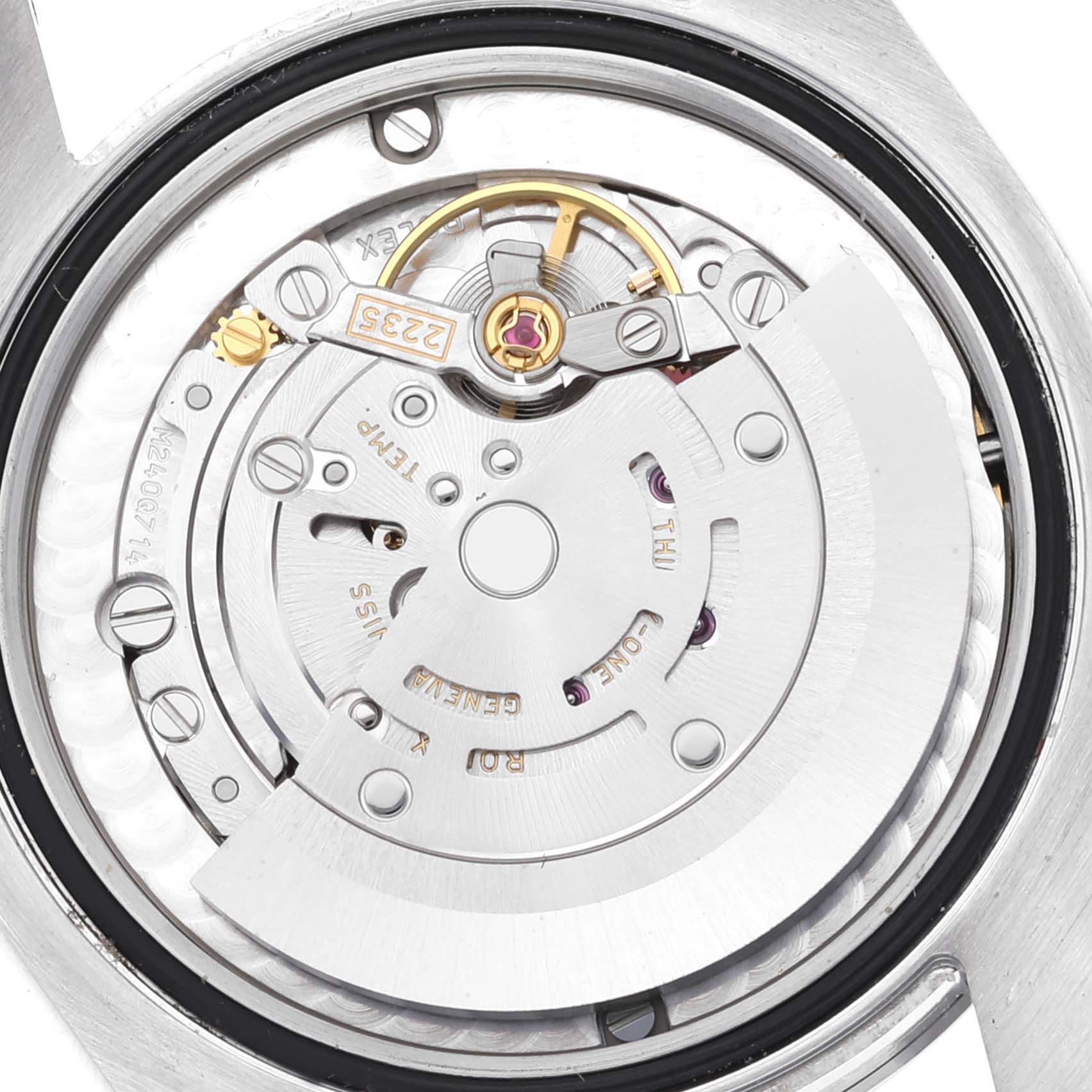 The image shows the internal movement mechanism of a Mid-Size Rolex watch from a top-down angle.