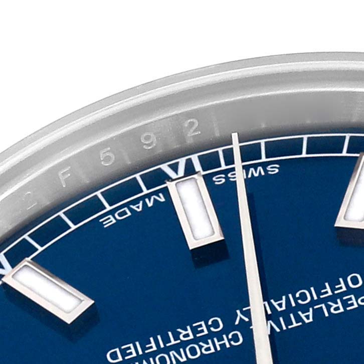 This image shows a close-up of the dial, bezel, and hour markers of a Rolex Mid-Size 178240 Women's Stainless Steel Blue Dial 178240 Women's Stainless Steel Blue Dial watch.