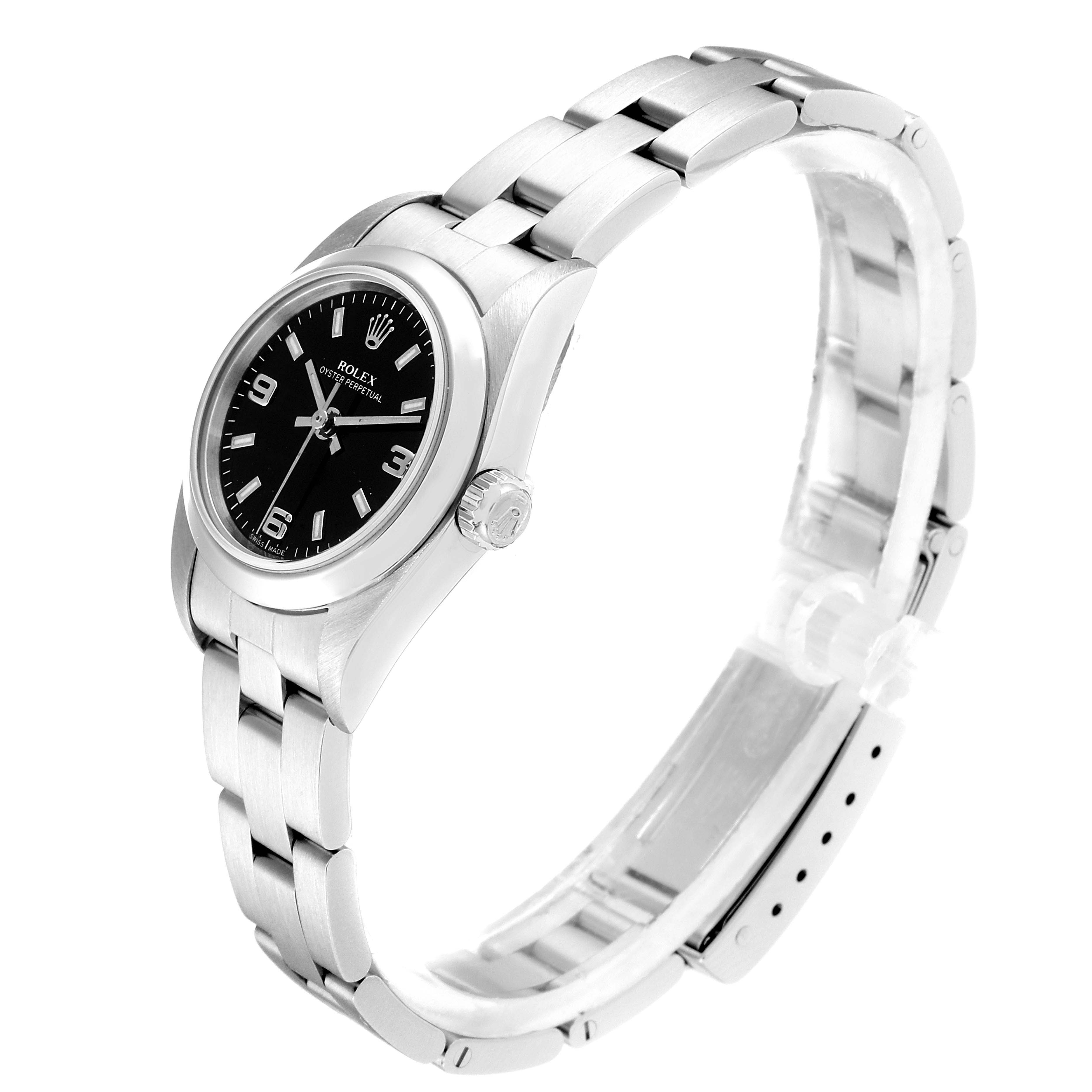 The Rolex Oyster Perpetual 76080 Women's Stainless Steel Black Dial 76080 Women's Stainless Steel Black Dial watch is shown in a 3/4 view, highlighting the face, crown, and bracelet.