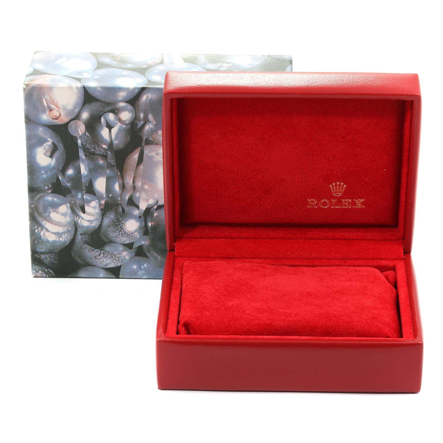 The image shows an open red Rolex box with the Oyster Perpetual branding visible on the inside.