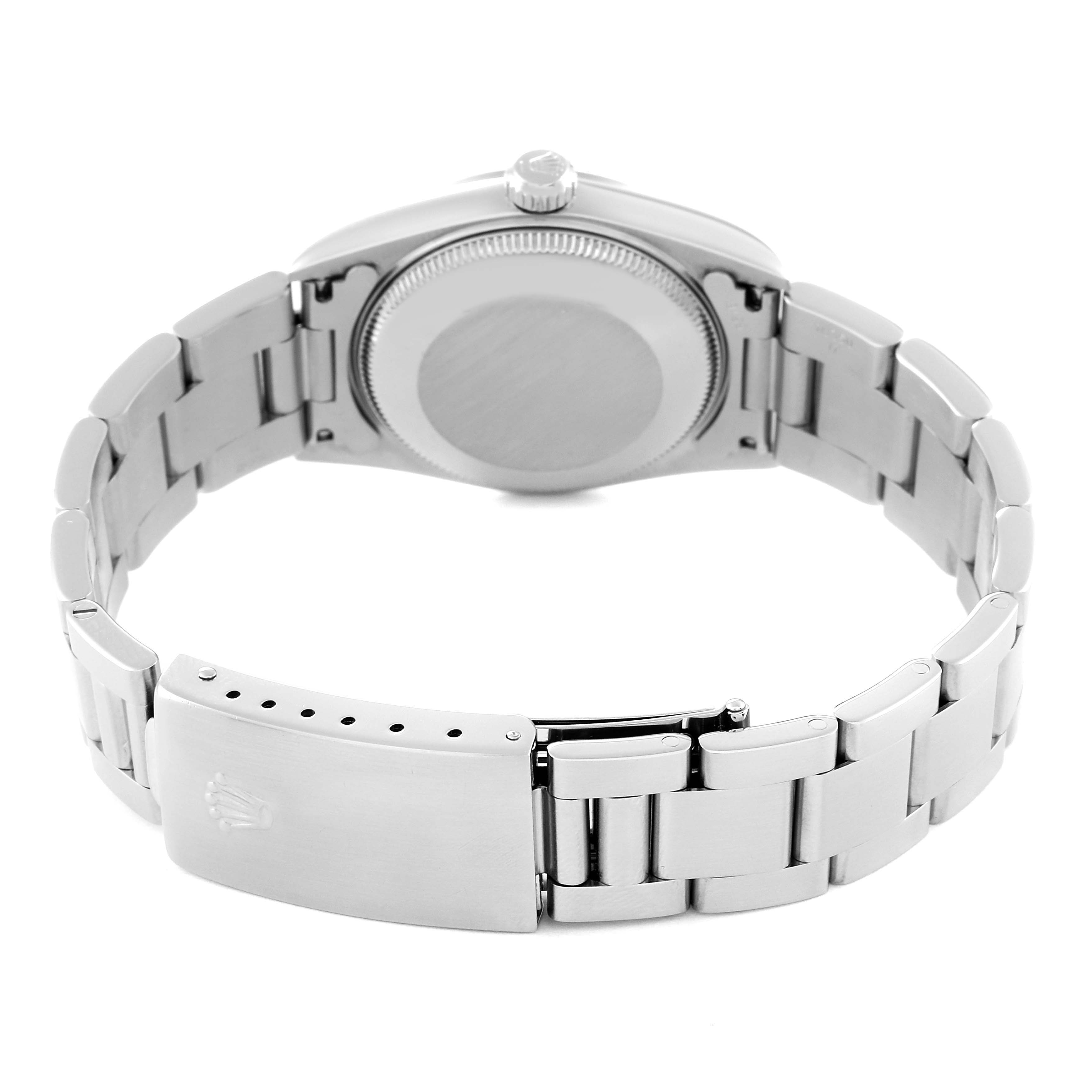 This image shows the back case and clasp of a Mid-Size Rolex watch.