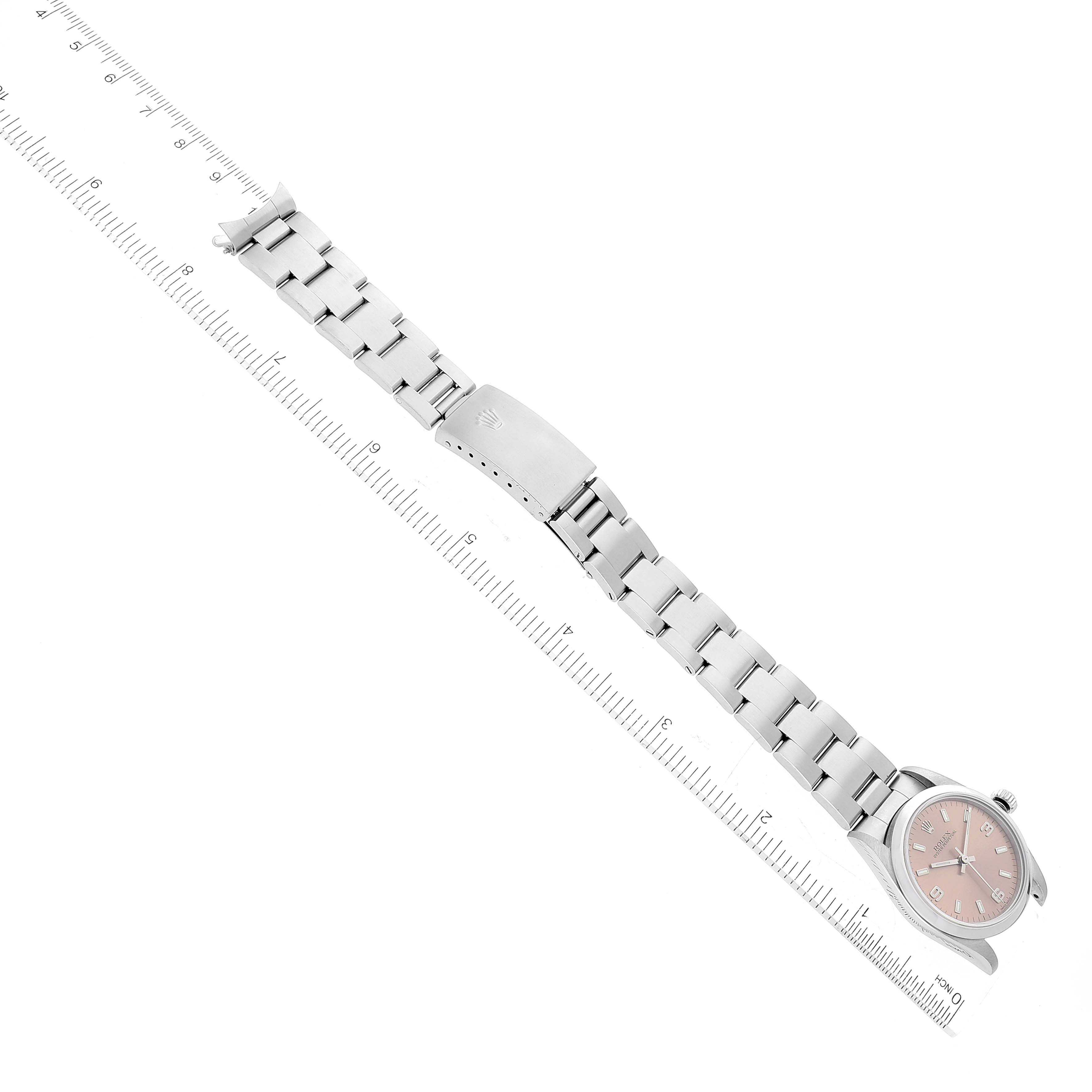 This image shows a Rolex Mid-Size 77080 Women's Stainless Steel Pink Dial 77080 Women's Stainless Steel Pink Dial model watch from an overhead view displaying the dial, bracelet, and clasp.