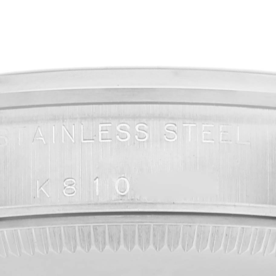 This is a close-up of the stainless steel engraving on the back case of a Rolex Mid-Size 77080 Women's Stainless Steel Pink Dial 77080 Women's Stainless Steel Pink Dial model watch.