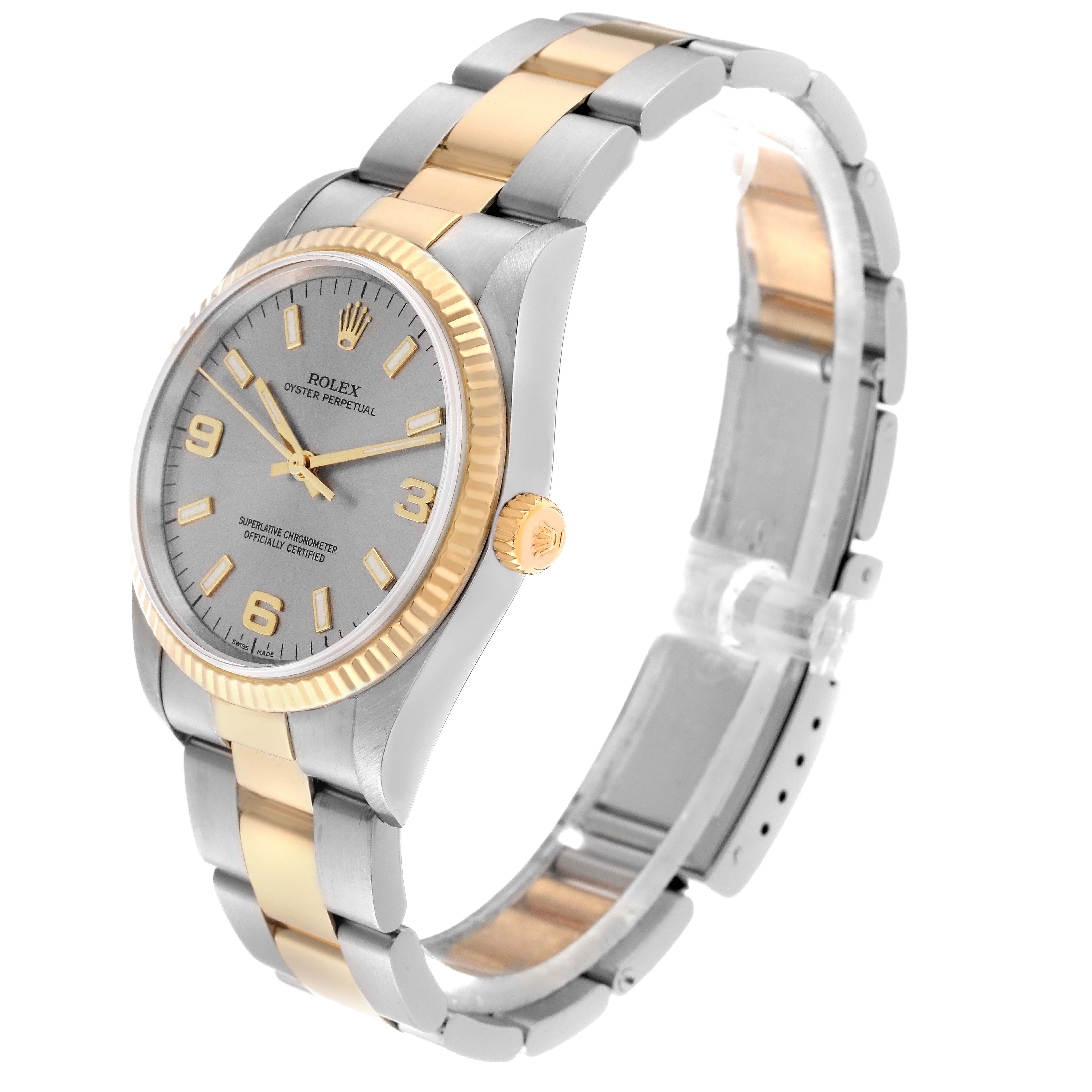 This image shows a Rolex Oyster Perpetual 14233 Men's Steel and Gold (two tone) Silver Dial 14233 Men's Steel and Gold (two tone) Silver Dial watch from a three-quarter angle, highlighting the bracelet, dial, and crown.