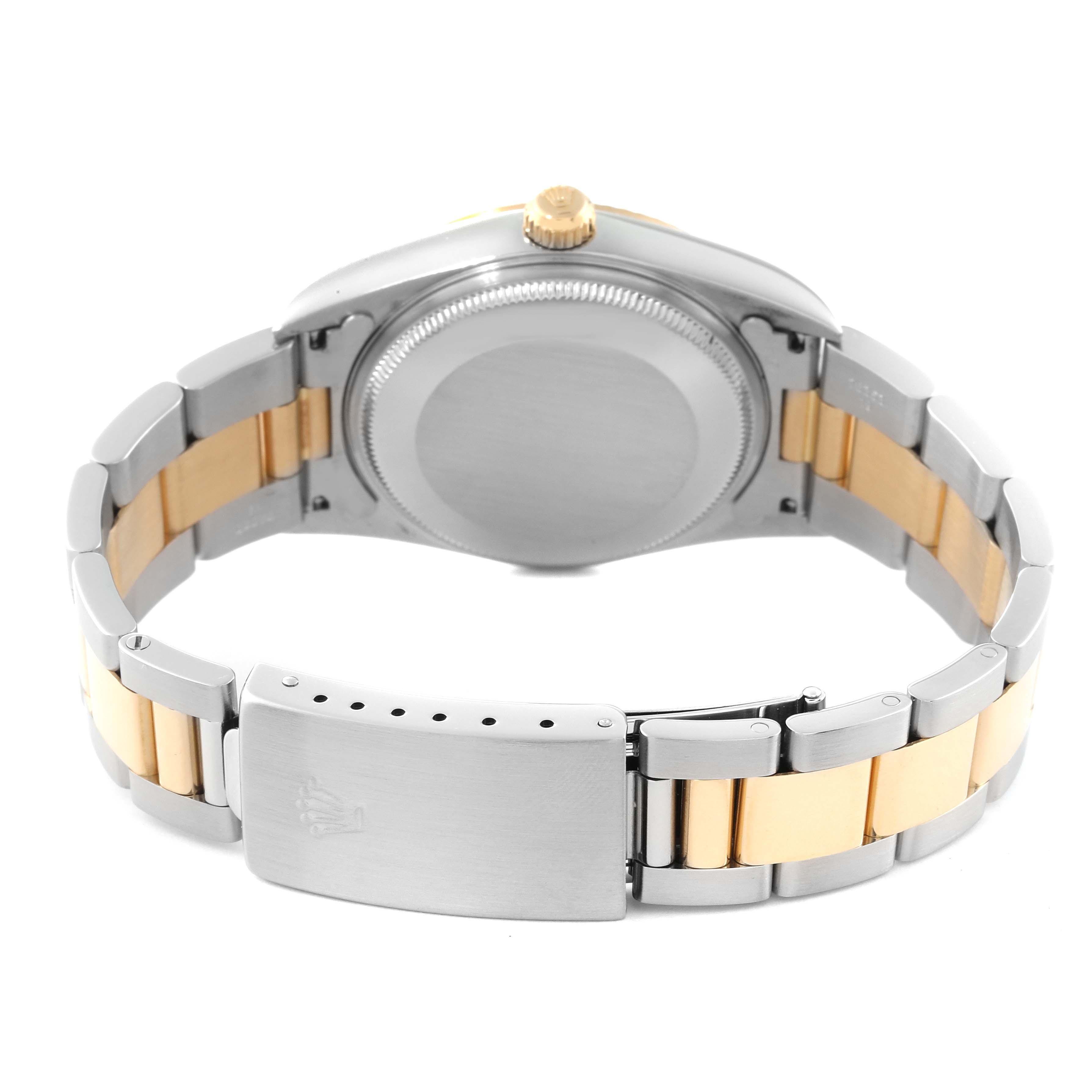 This image shows the back view of a Rolex Oyster Perpetual 14233 Men's Steel and Gold (two tone) Silver Dial 14233 Men's Steel and Gold (two tone) Silver Dial watch, focusing on the case back and two-tone bracelet with clasp.