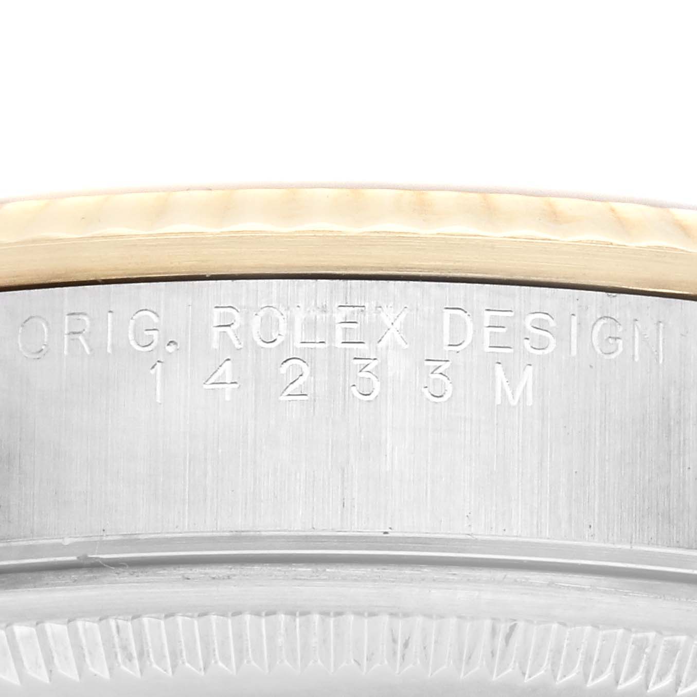 The image shows a close-up of the engraved side of the bezel and case of a Rolex Oyster Perpetual 14233 Men's Steel and Gold (two tone) Silver Dial 14233 Men's Steel and Gold (two tone) Silver Dial watch.