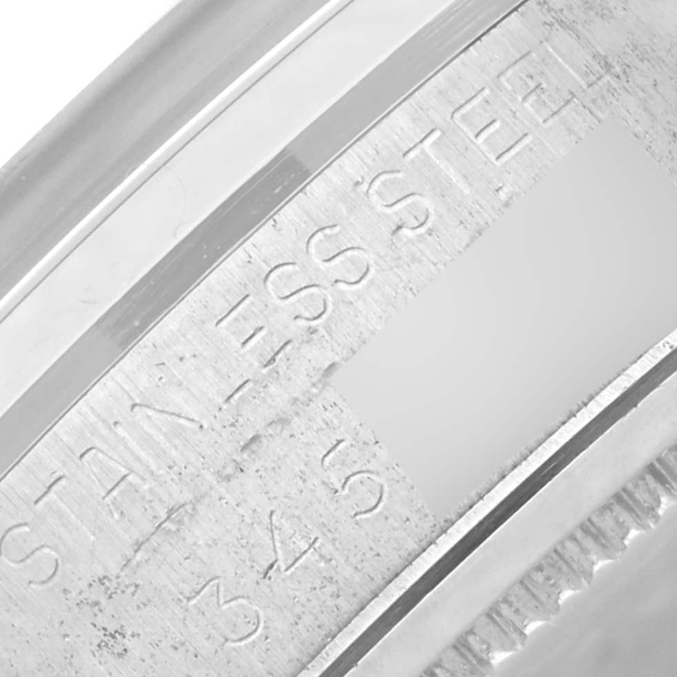 This close-up image of the Rolex Vintage Collection 6694 Men's Stainless Steel Silver Dial 6694 Men's Stainless Steel Silver Dial model showcases the engraving on the stainless steel casing.